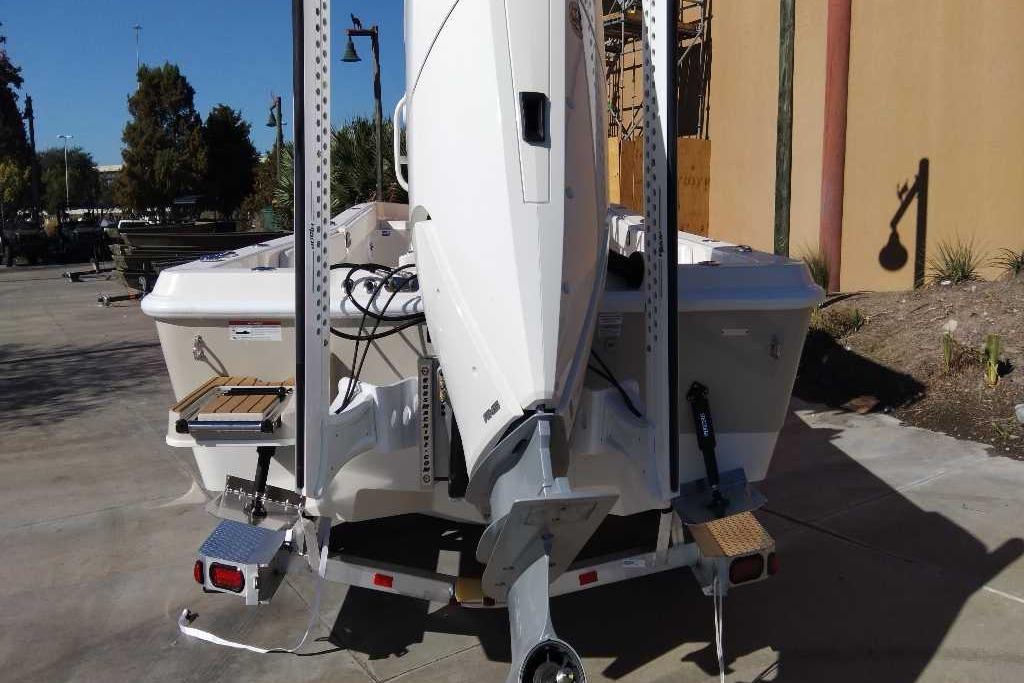 2026 Ranger 2510 Bay boat on trailer, rear view with motor and accessories.