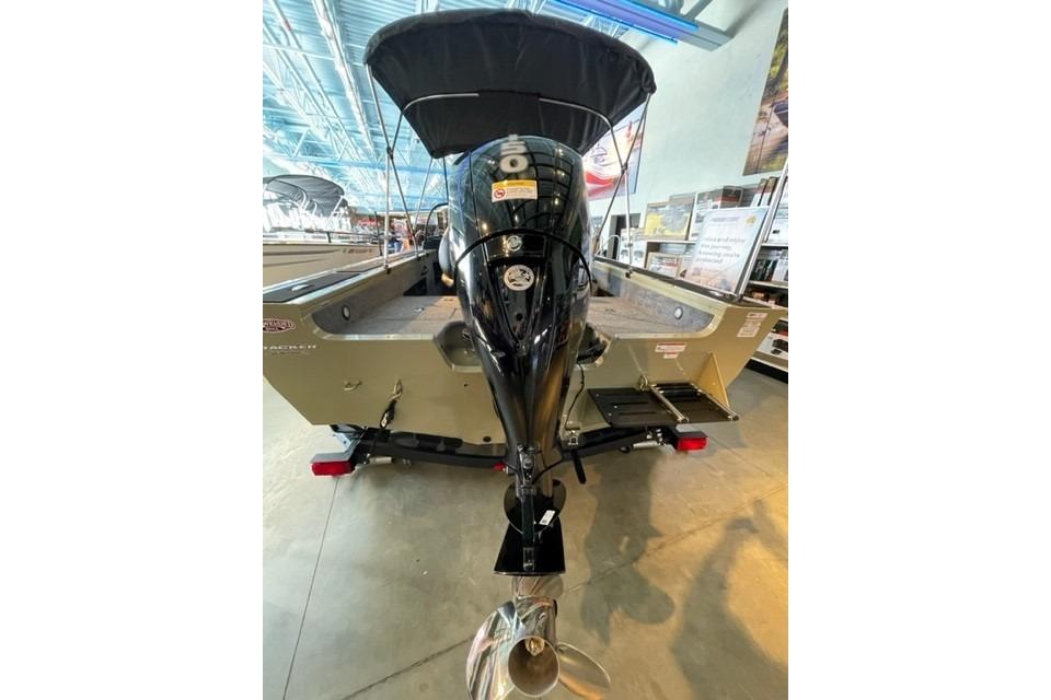 2026 Tracker Targa V-18 WT boat with outboard motor in showroom.