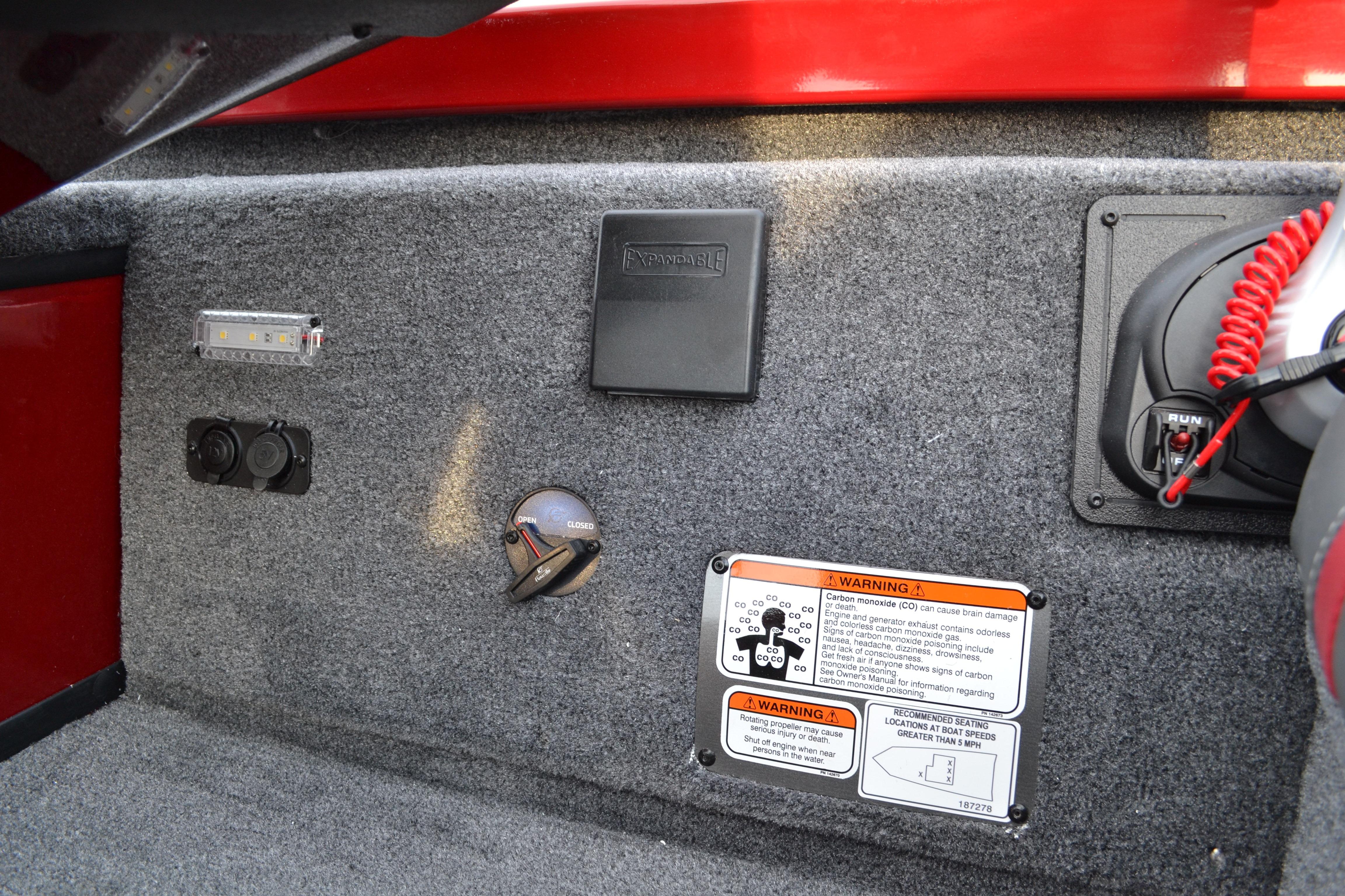2026 Ranger RT188 boat dashboard with controls, warning labels, and red safety cord.
