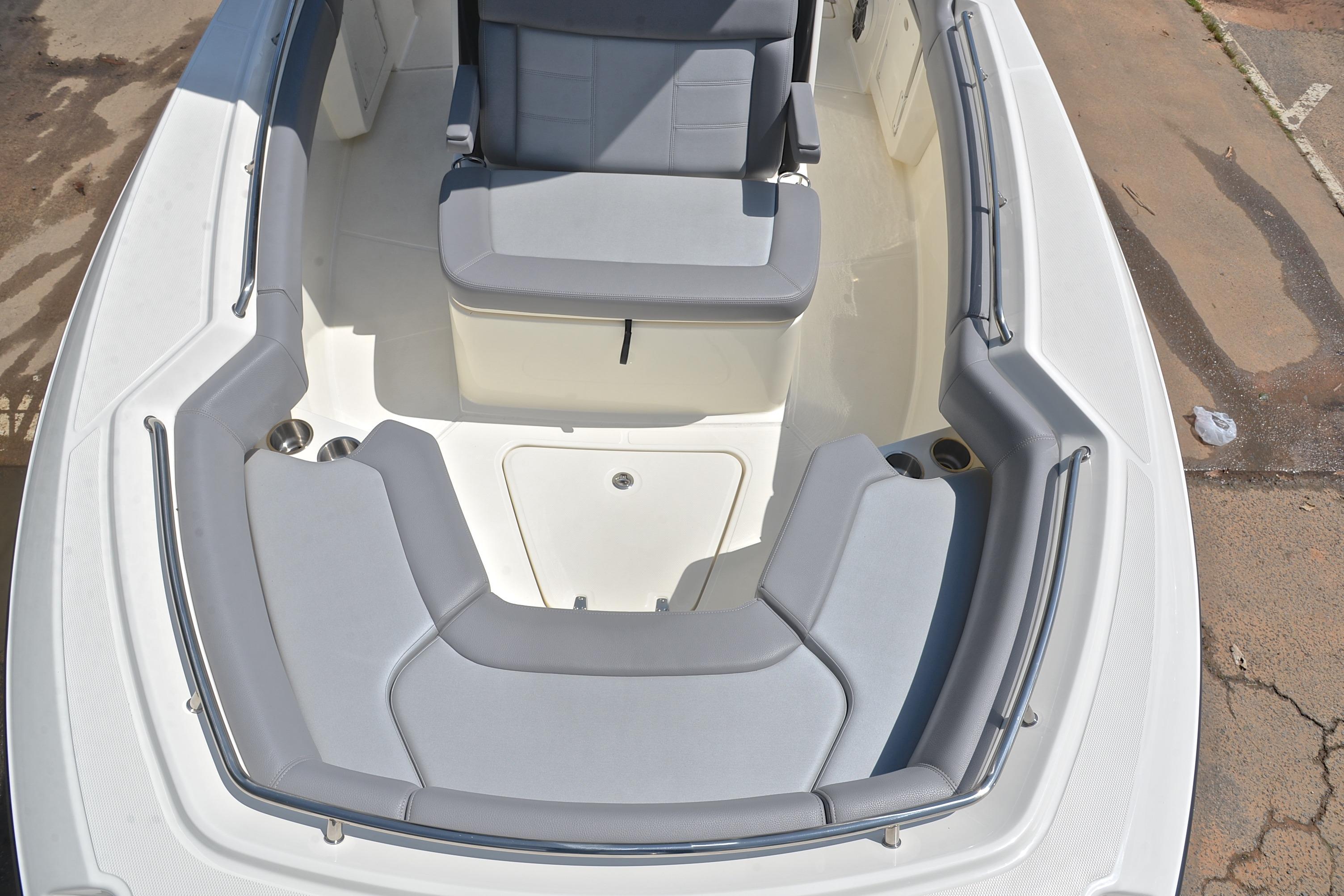2024 Boston Whaler 250 Outrage boat interior with gray seating and spacious layout.