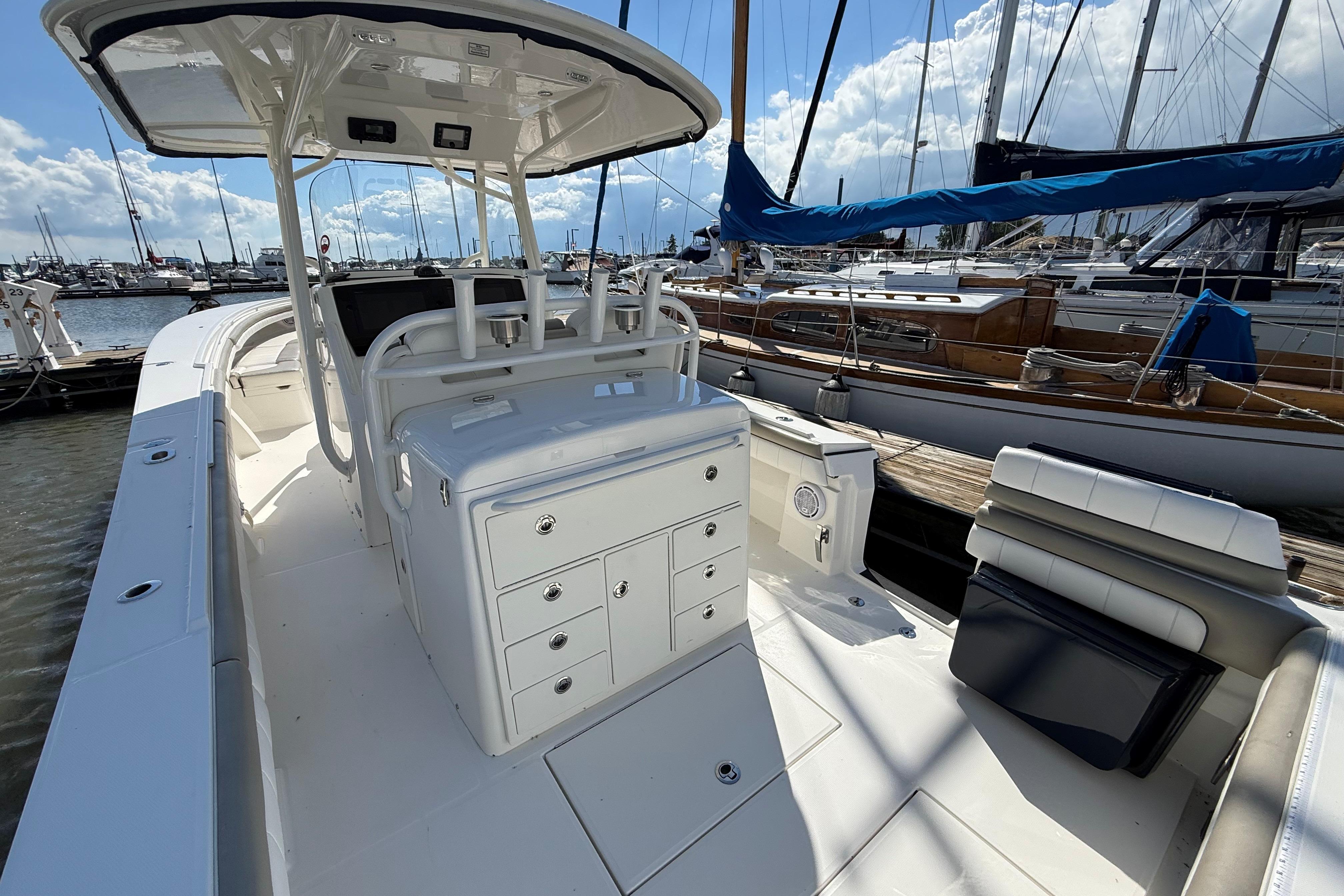2019 Regulator 34SS boat interior at marina, featuring helm and seating area.