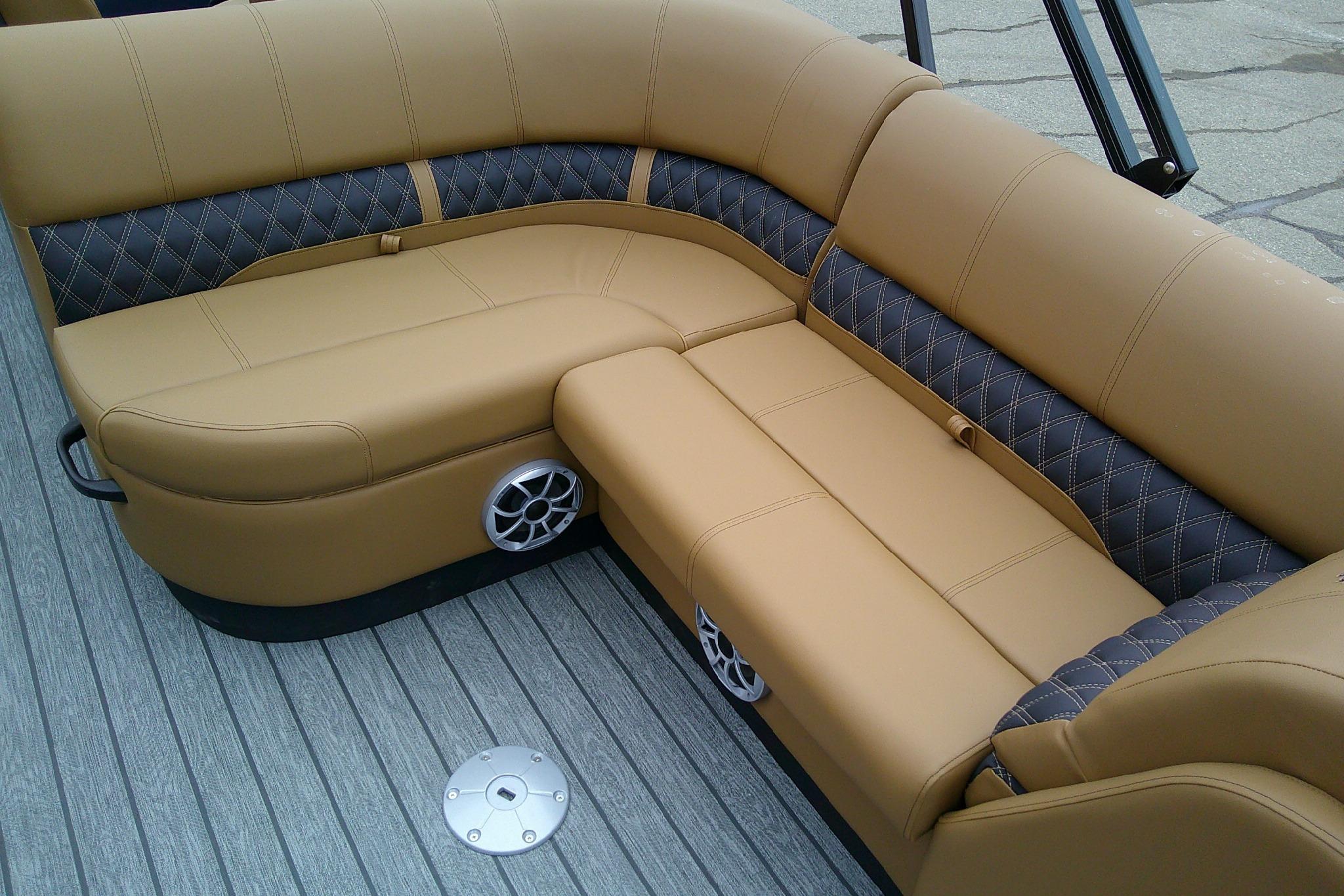 Luxurious seating on 2026 Ranger 220FC boat with tan and black upholstery.