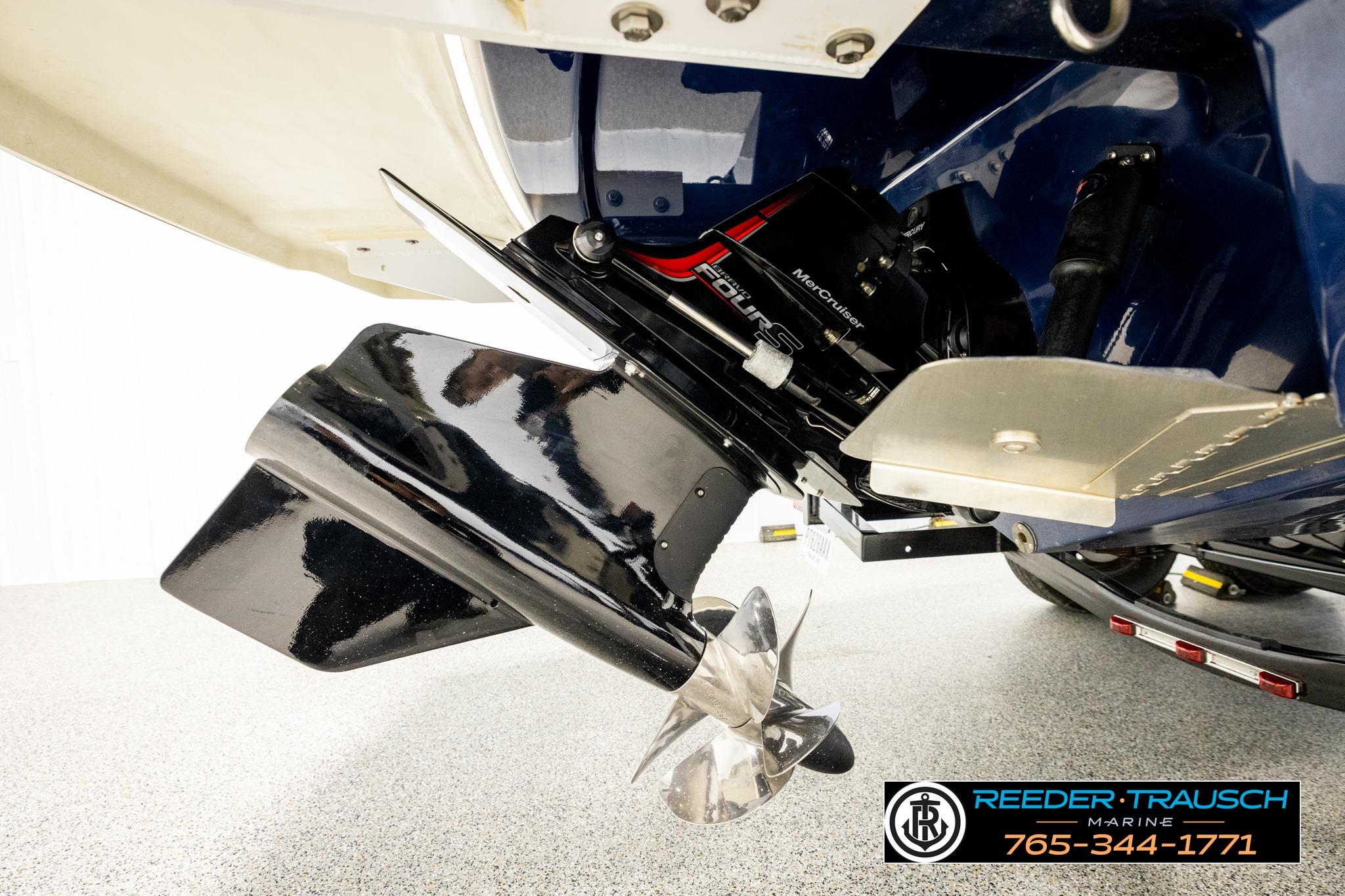 2024 FOURWINNS HD5 Surf boat engine and propeller detail, Reeder-Trausch Marine branding visible.
