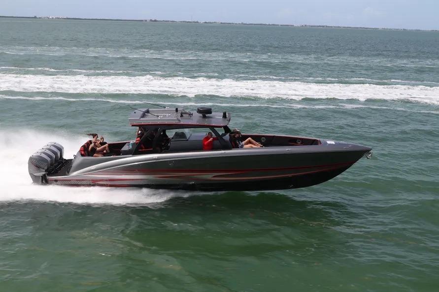 2021 Concept 44' Open Deck boat speeding on ocean waters.