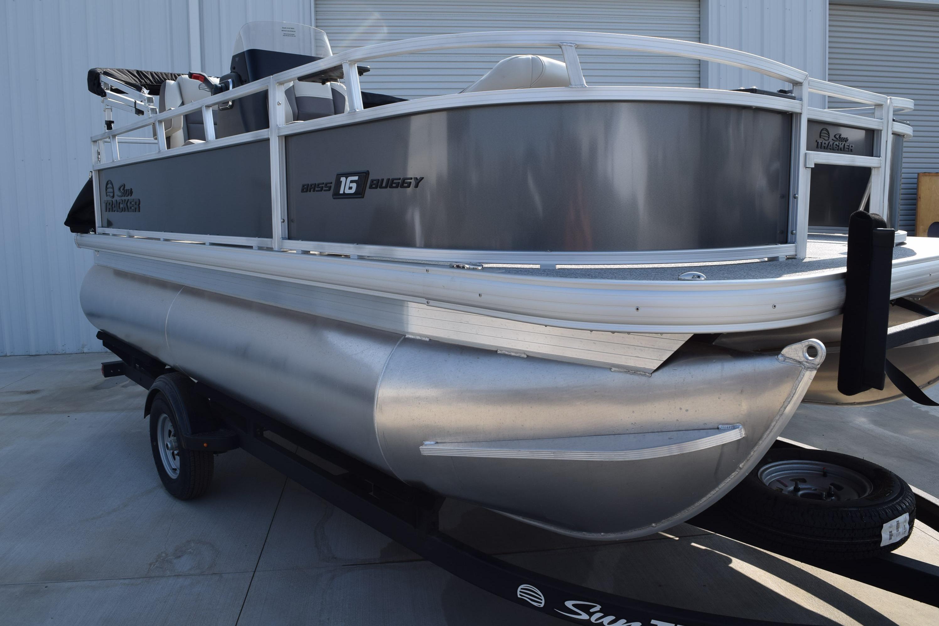 2026 Sun Tracker Bass Buggy 16 XL Select pontoon boat on trailer.