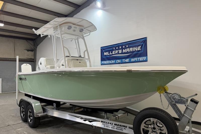 2026 Sea Pro 202 Center Console boat on trailer at Miller's Marine showroom.