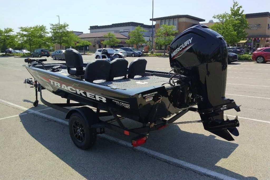 2026 Tracker Pro Team 175 Crappie Edition boat in parking lot, rear view.