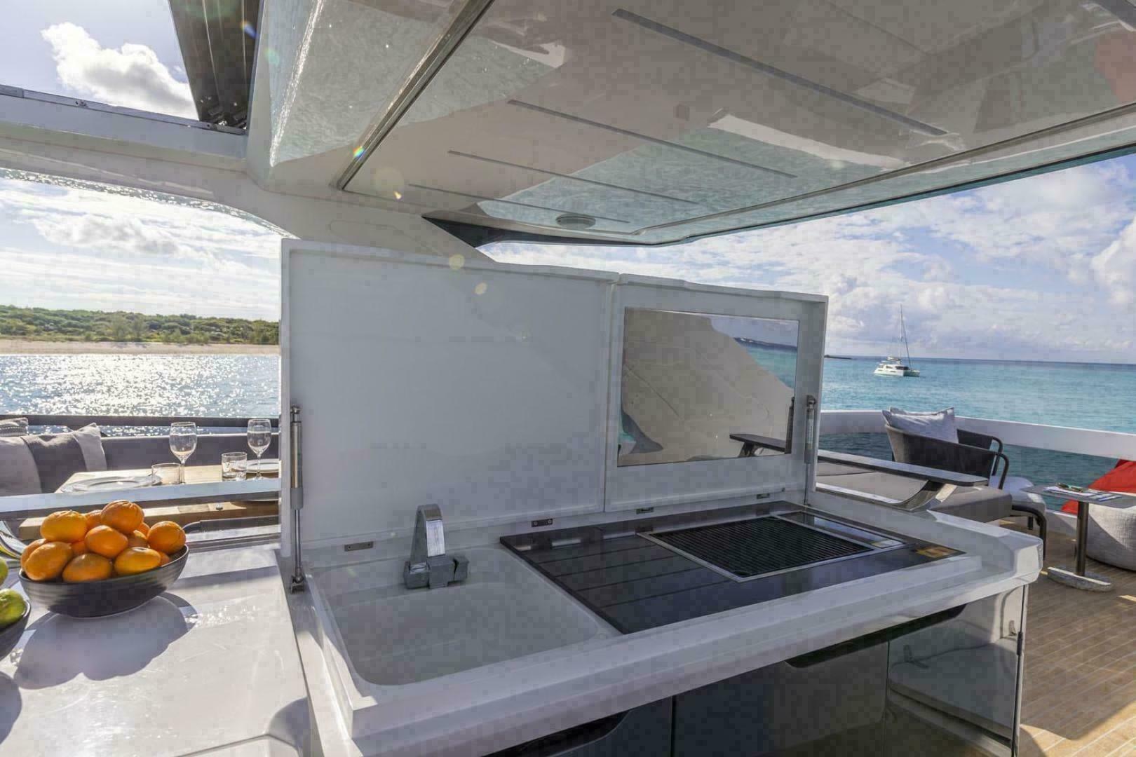 Luxury yacht Pearl 72 outdoor kitchen with ocean view, 2023 model.