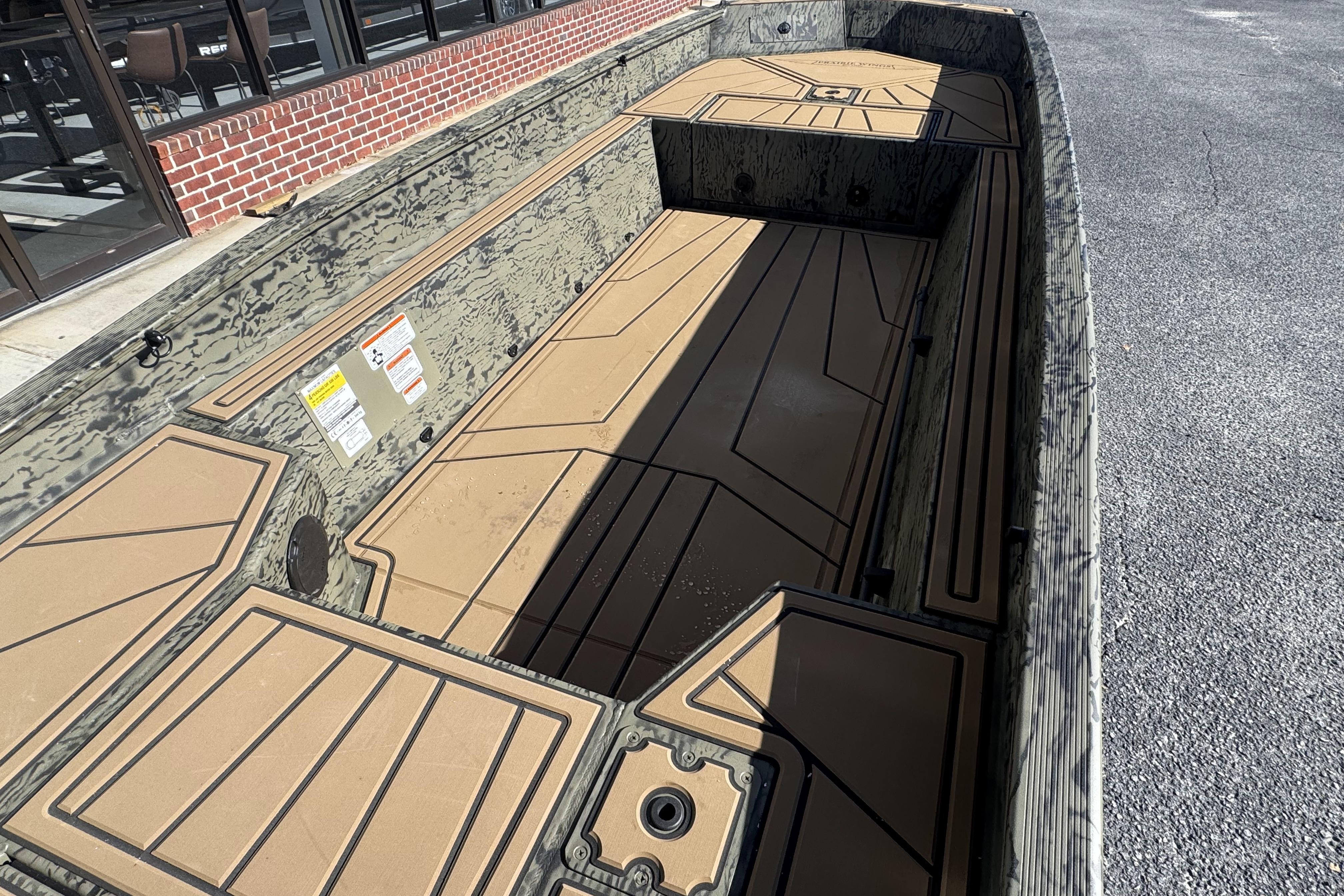 2026 Tracker Grizzly 1650 T Prairie Wings Edition boat interior with camouflage design.