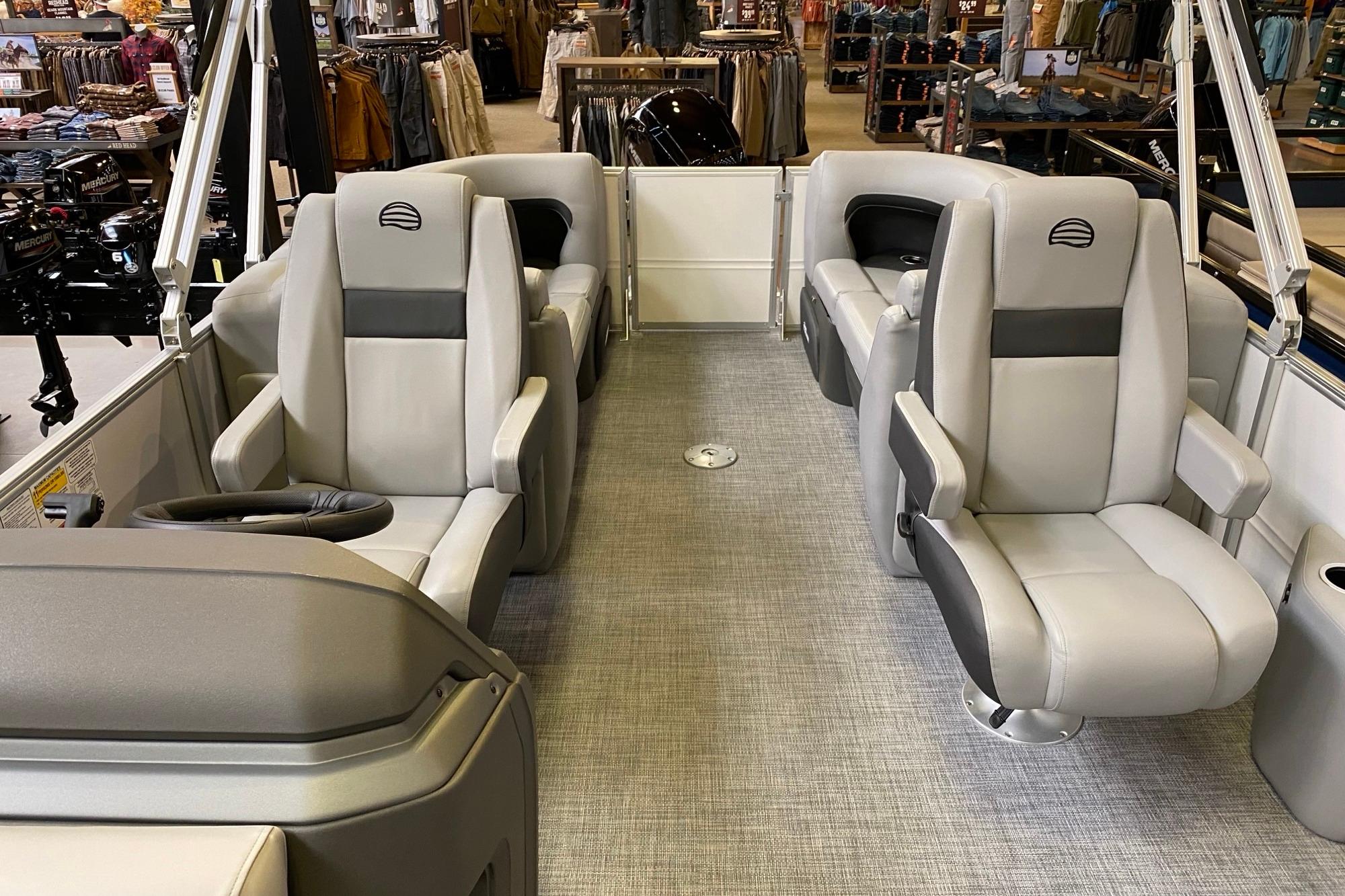 2026 Sun Tracker Party Barge 22 DLX interior with plush seating and modern design.