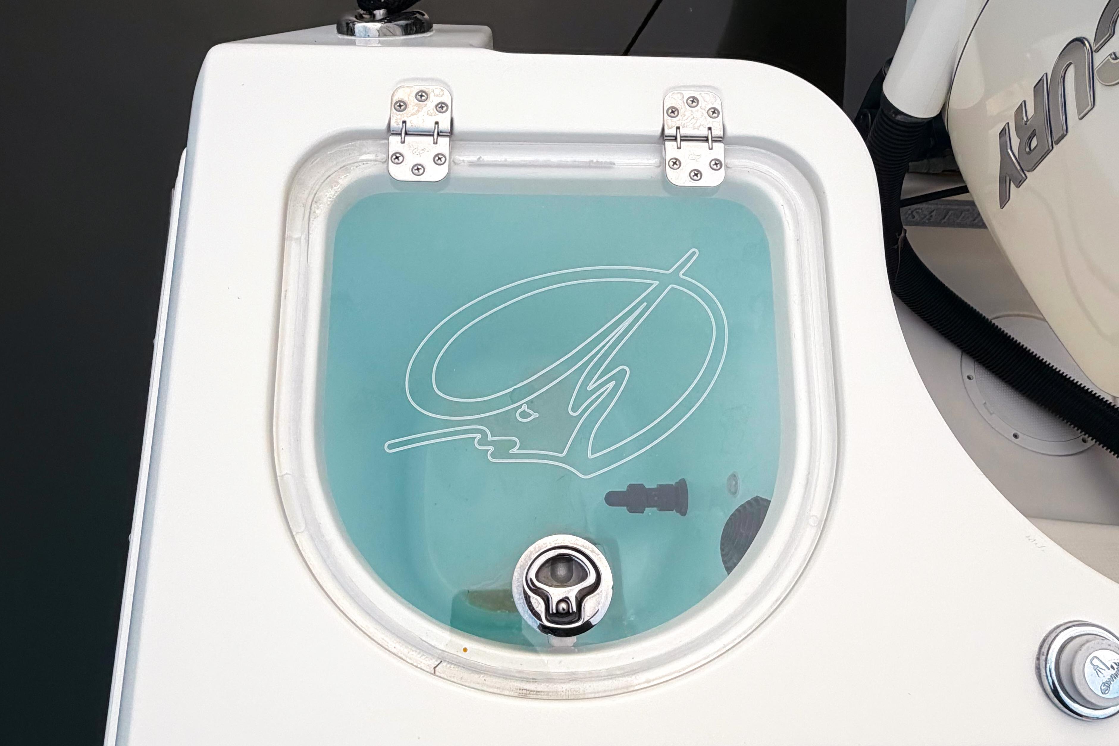 Livewell on 2016 Sailfish 290 CC boat with clear lid and logo.