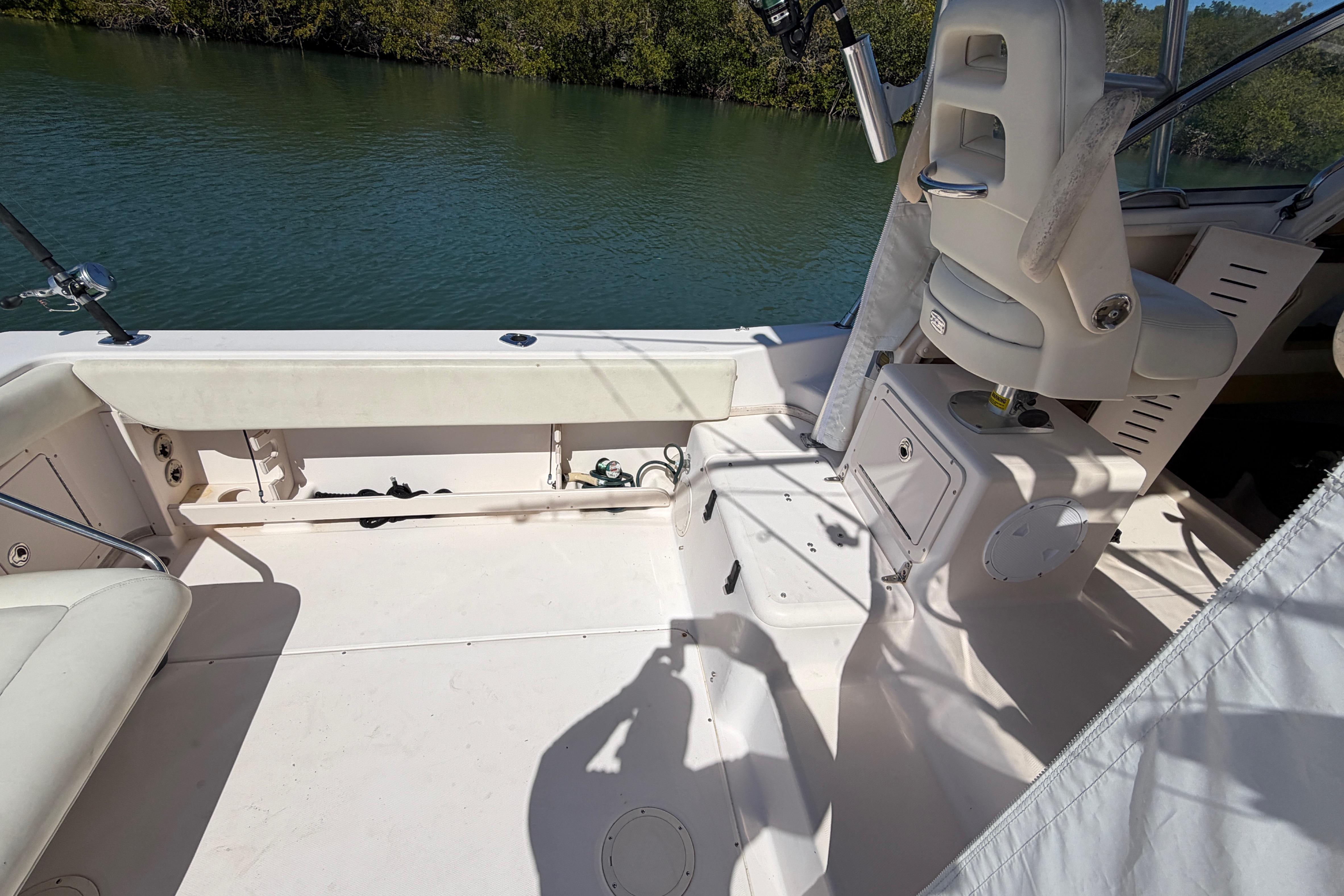 2006 Grady-White Sailfish 282 boat interior with seating and fishing rod holders.