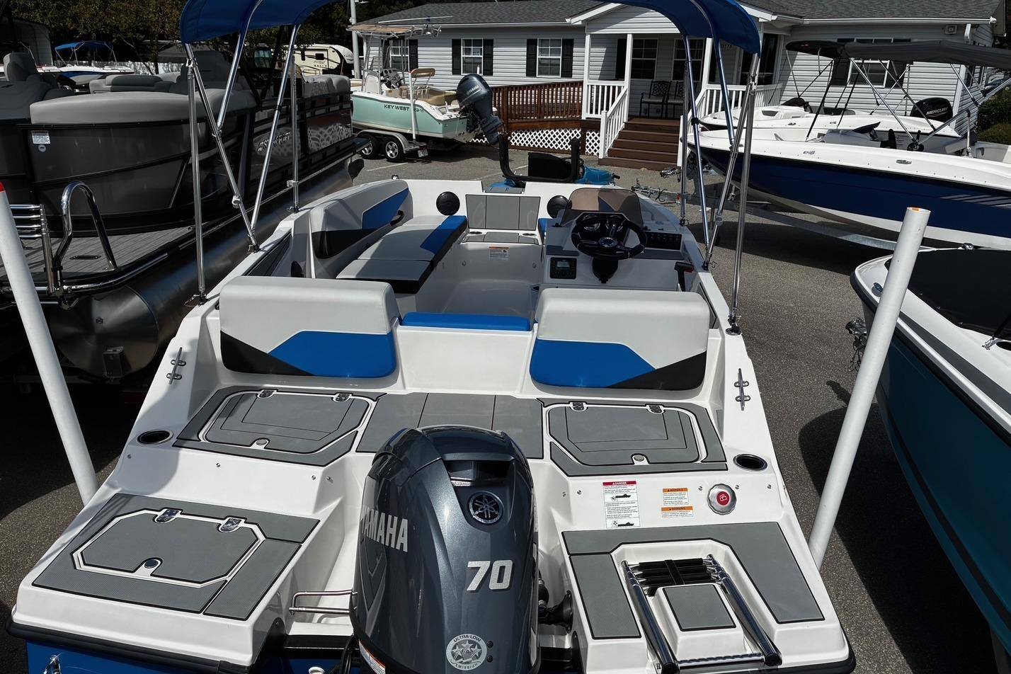 2026 Starcraft SV 16 OB boat with Yamaha 70 engine, docked at a marina.