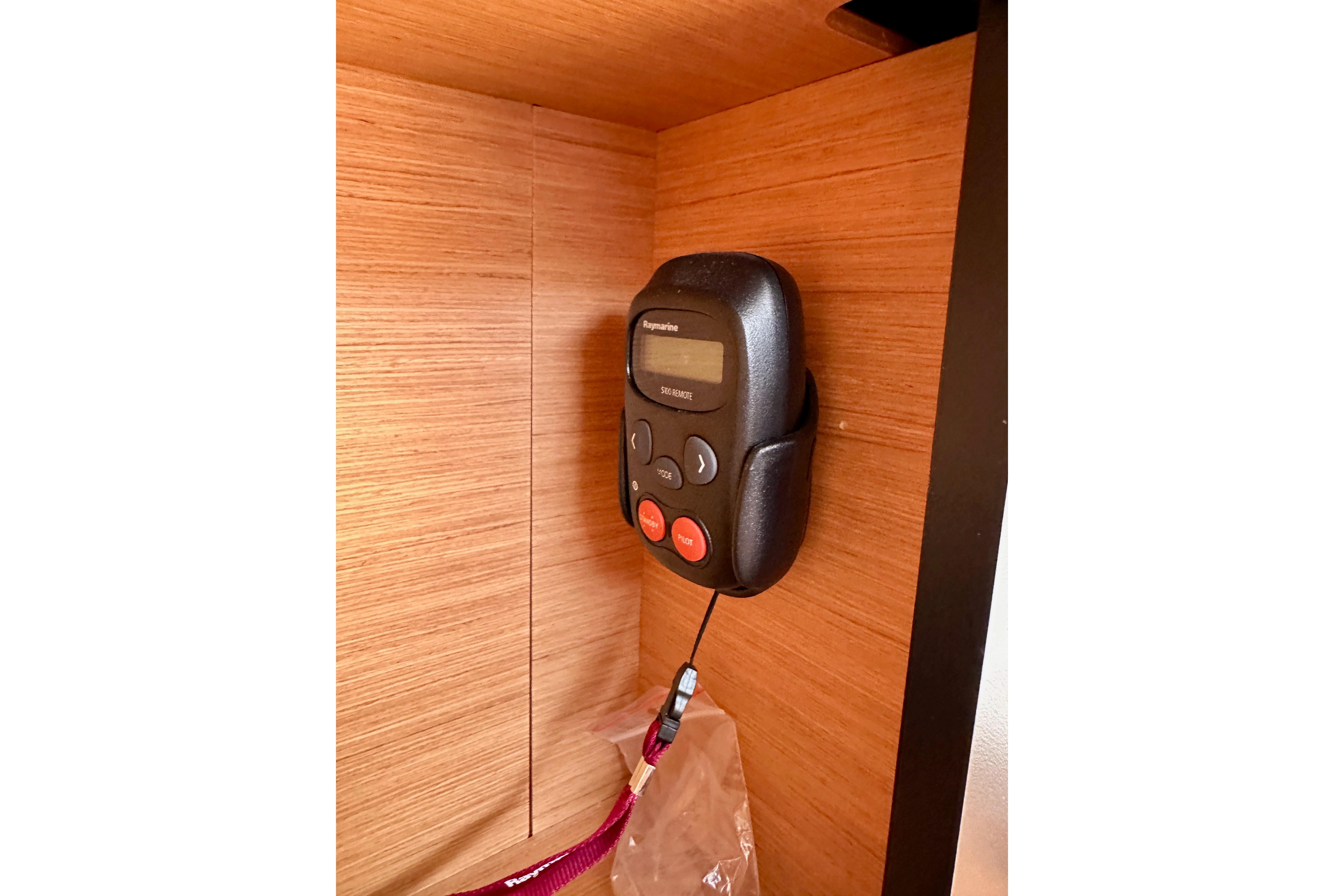 Control panel inside 2024 Jeanneau Sun Odyssey 410 yacht, mounted on wooden interior.