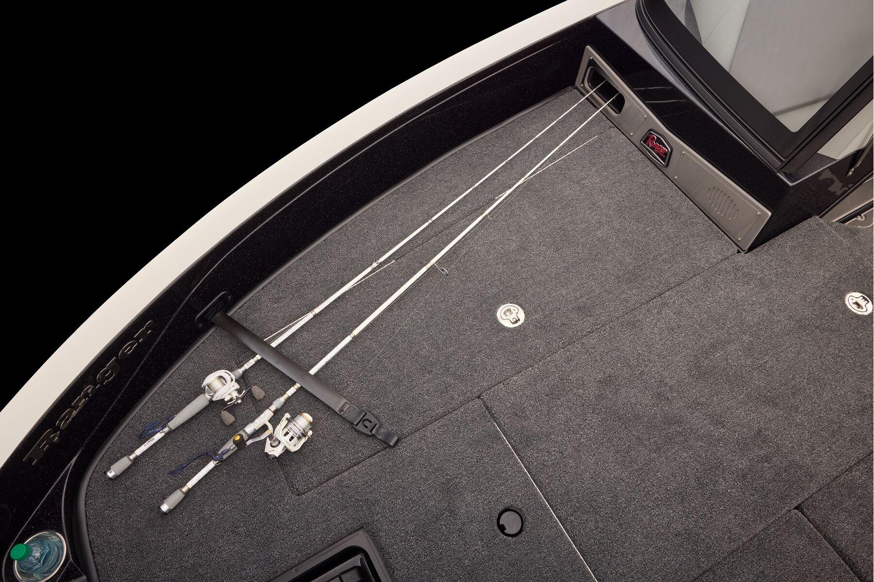 Manufacturer Provided Image: 2026 Ranger 620xFS Pro boat deck with fishing rods and storage compartments.