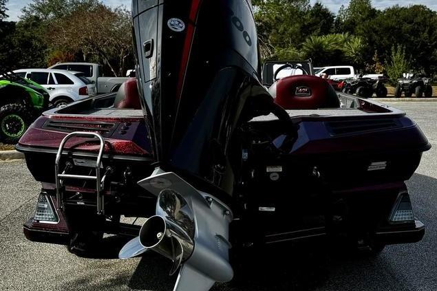 2026 Ranger Z518 Cup-Equipped boat with powerful outboard motor, parked outdoors.