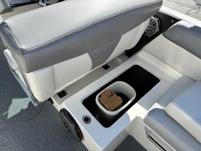 2016 MasterCraft X46 boat interior storage compartment with seating and speaker.