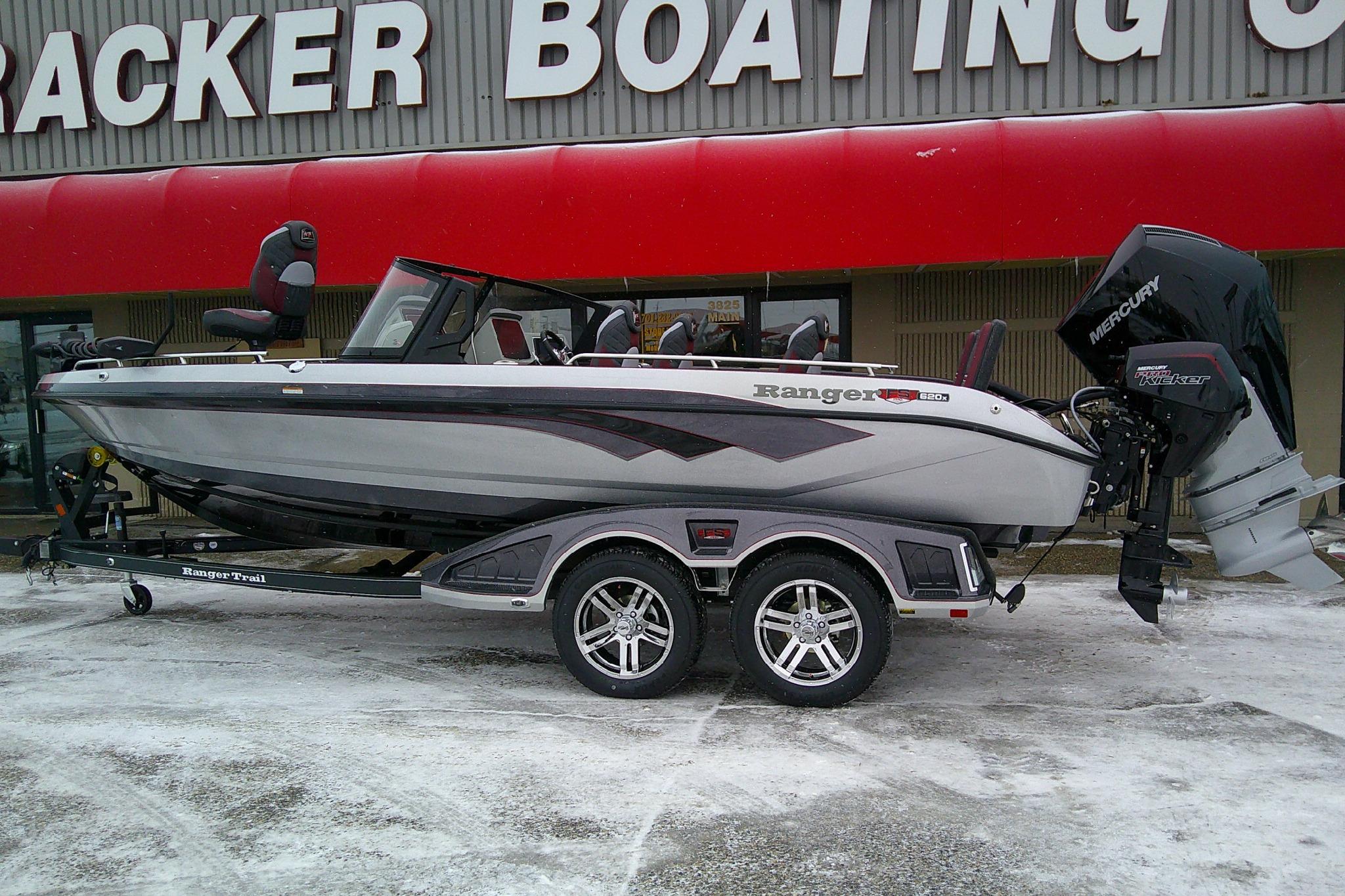 2026 Ranger 620xFS Pro boat on trailer outside boating store.