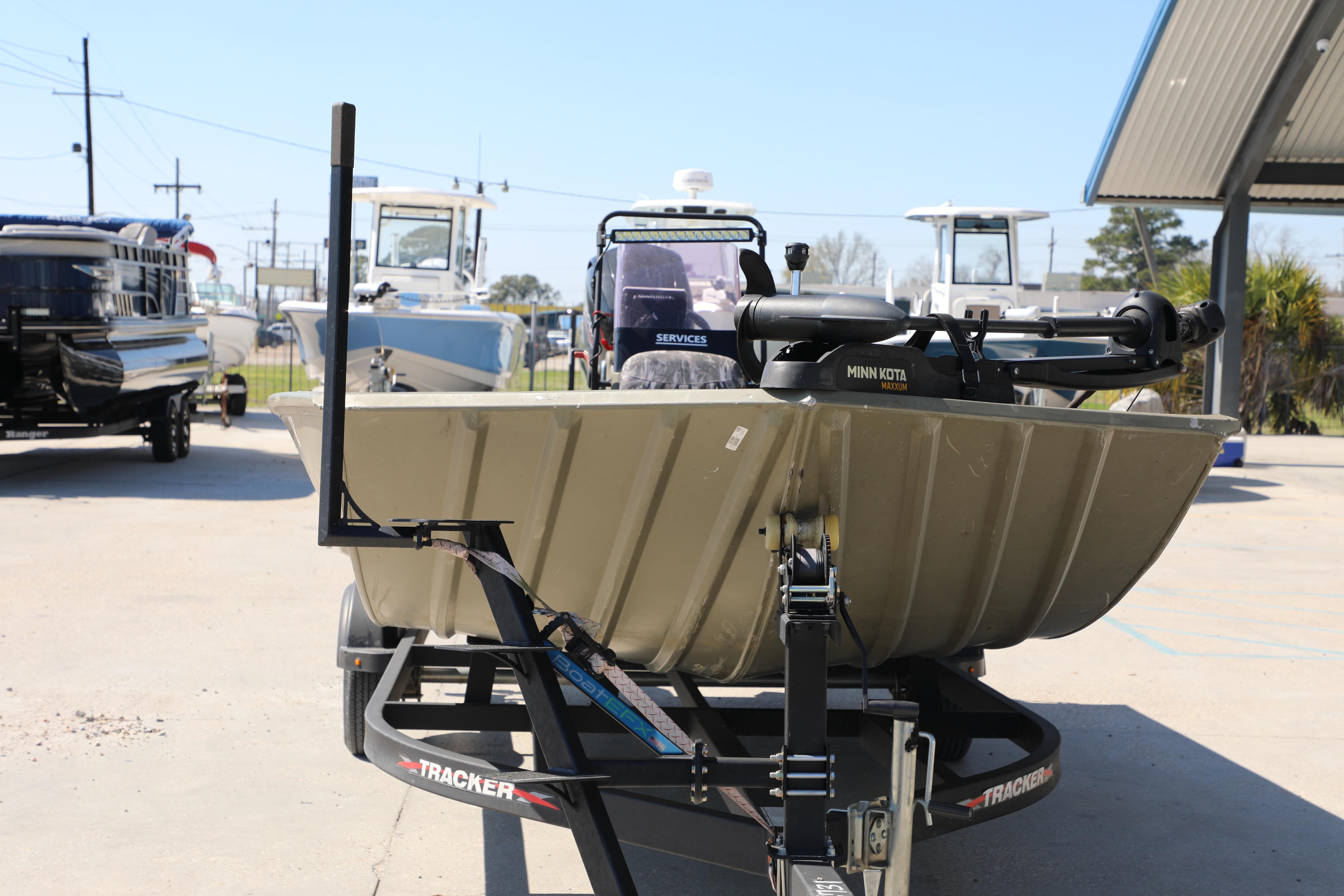 2021 Tracker Grizzly 2072 SC All-Welded boat on trailer, outdoor display.