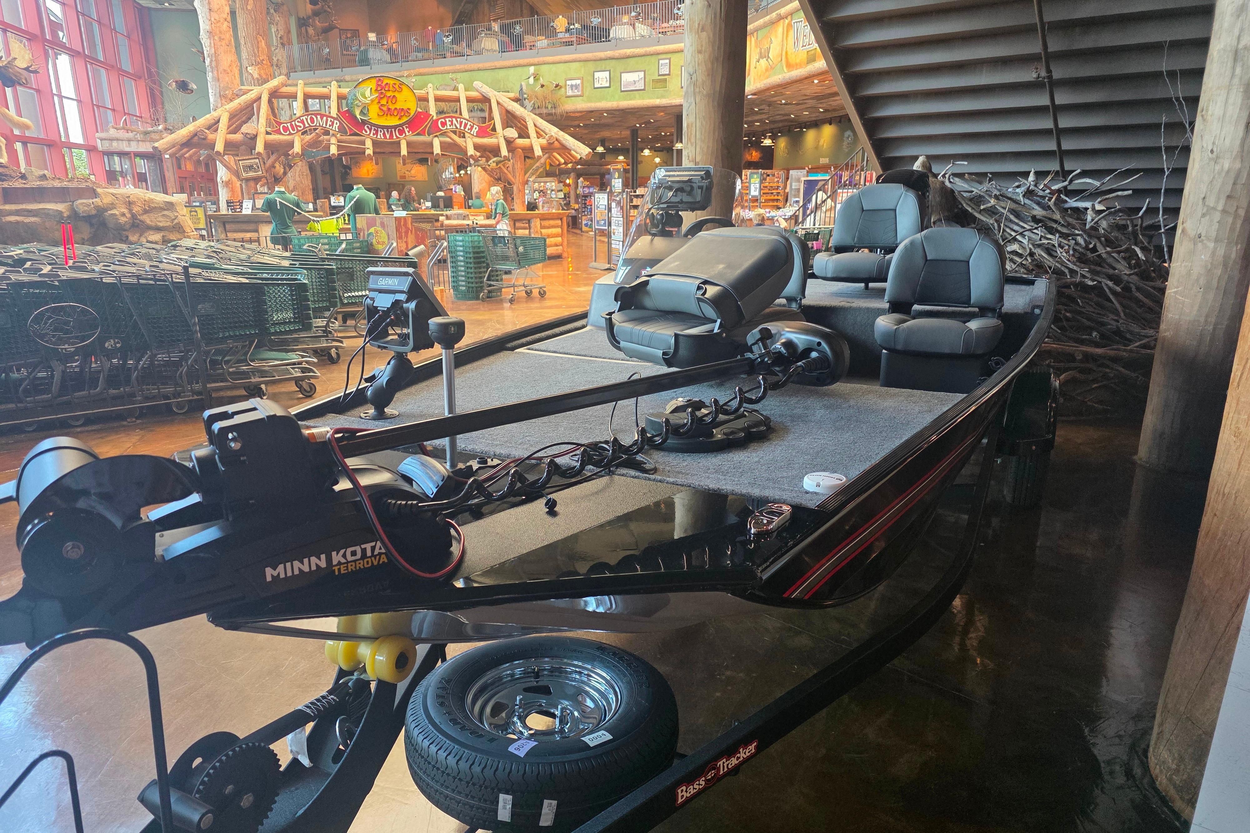 2026 Tracker Bass Tracker Classic XL boat displayed indoors at Bass Pro Shops.