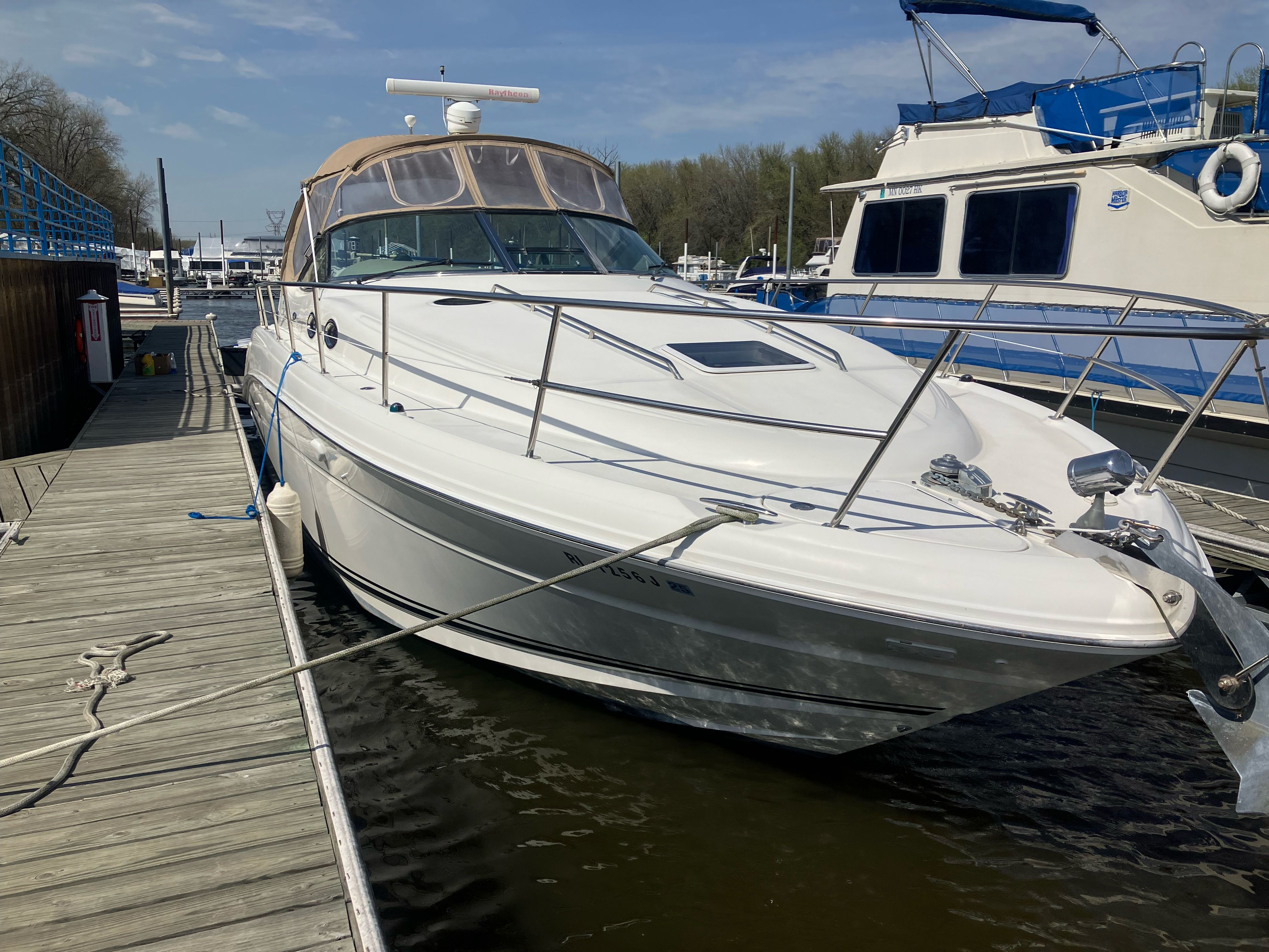 2002 Sea Ray 360 Sundancer docked on a sunny day.