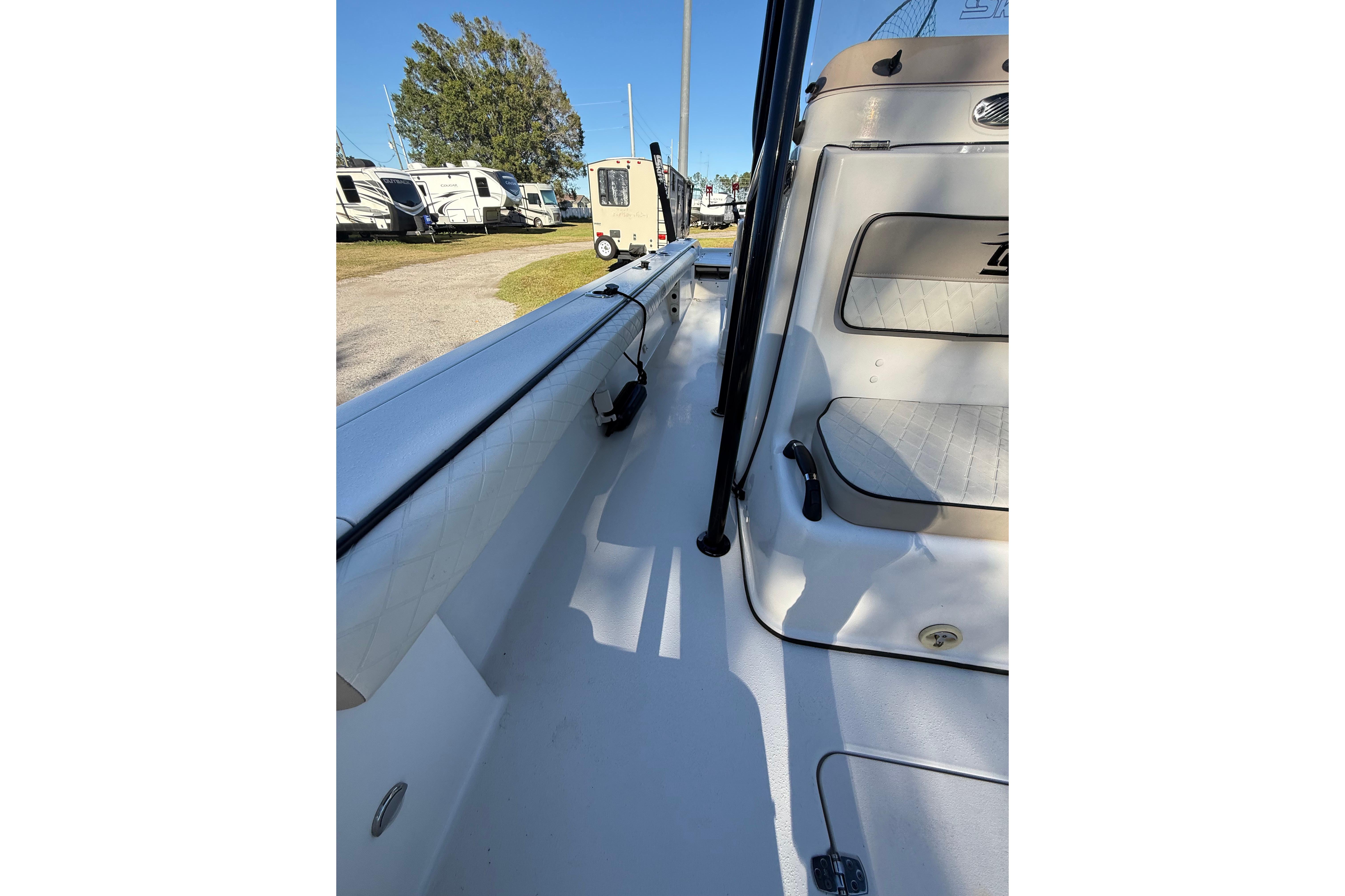 2021 Carolina Skiff 26 Ultra Elite boat interior with seating and storage.