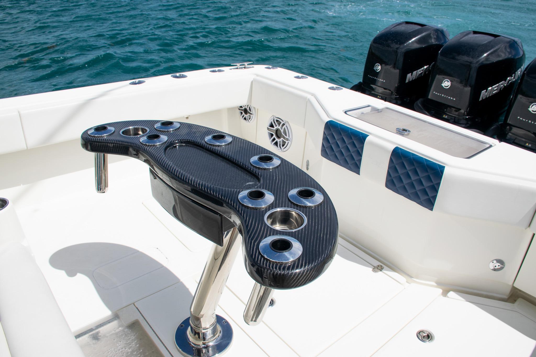 2022 SeaVee 390Z boat deck with rod holders and Mercury engines.