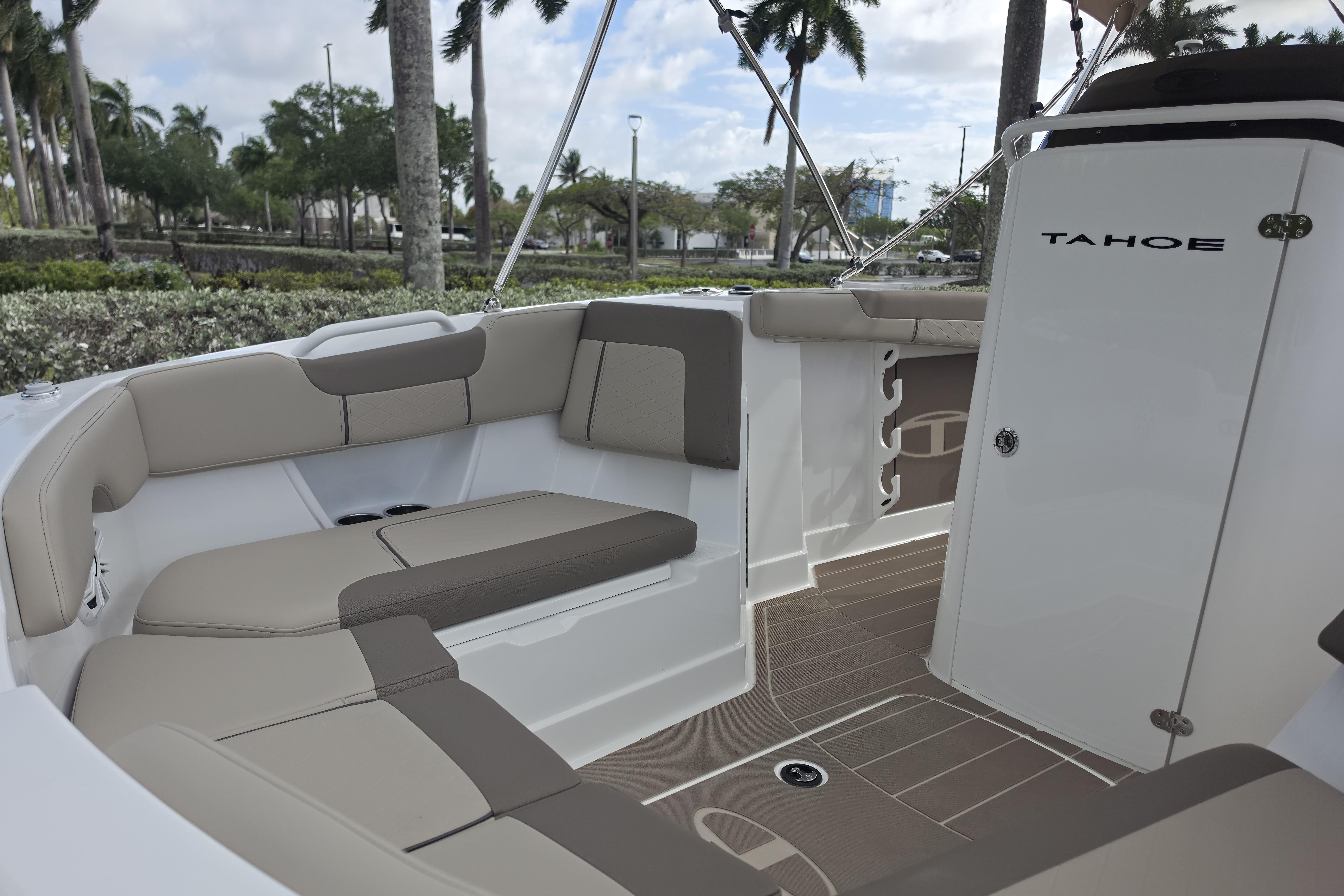 2026 Tahoe 2150 CC boat interior with beige seating and sleek design.