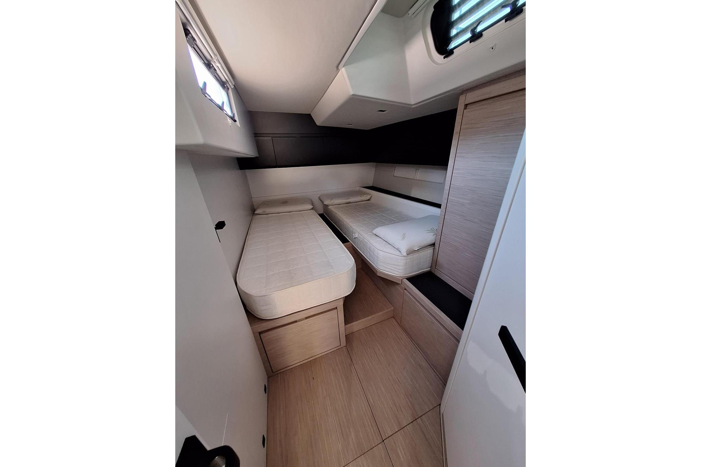 Interior cabin of 2019 Ice Yachts 60, featuring twin beds and modern design.