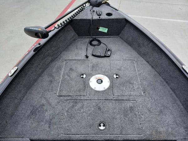 2025 Tracker Super Guide V-16 T boat deck with trolling motor and storage compartments.