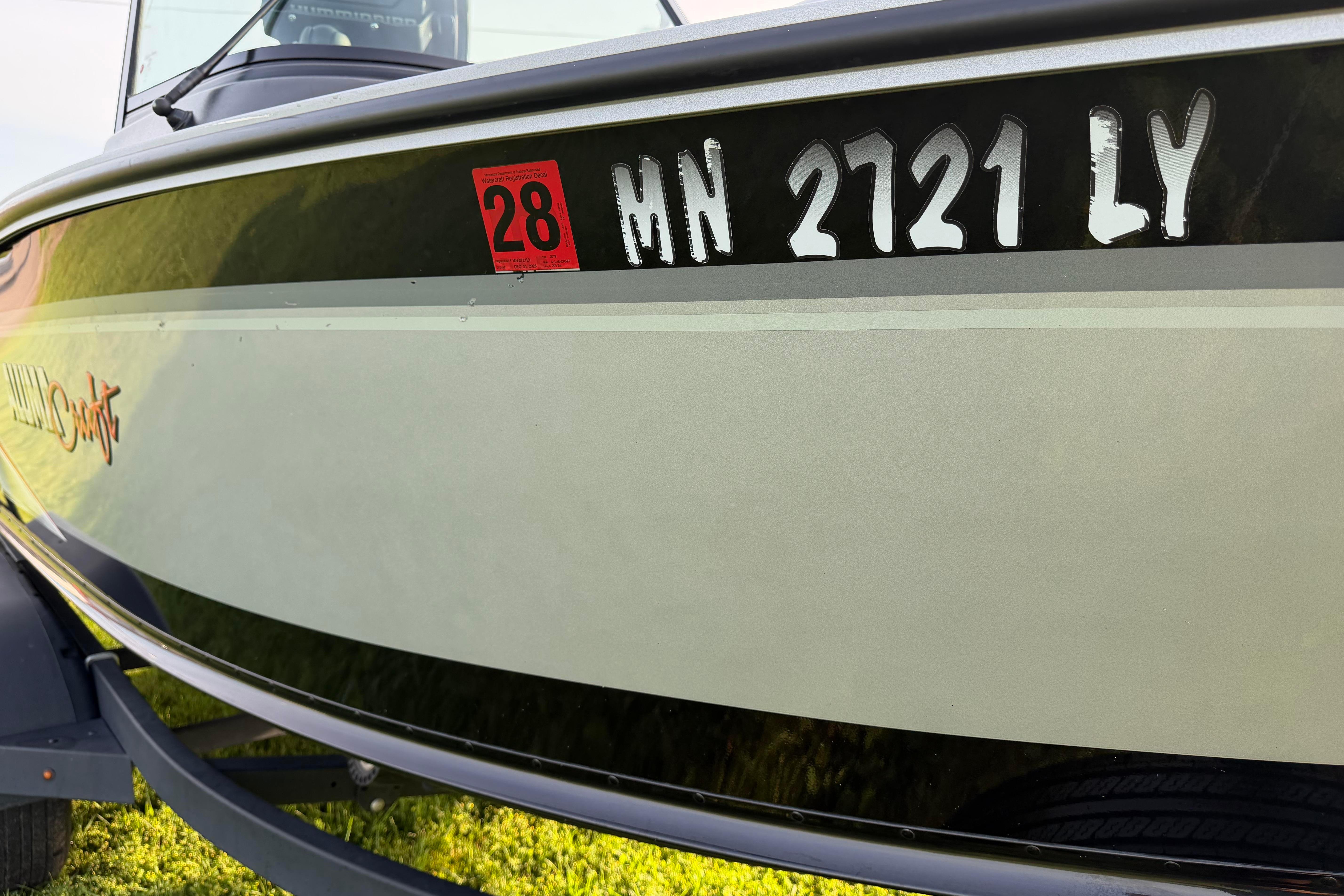 2019 Alumacraft Trophy 205 boat with registration MN 2721 LY, side view.