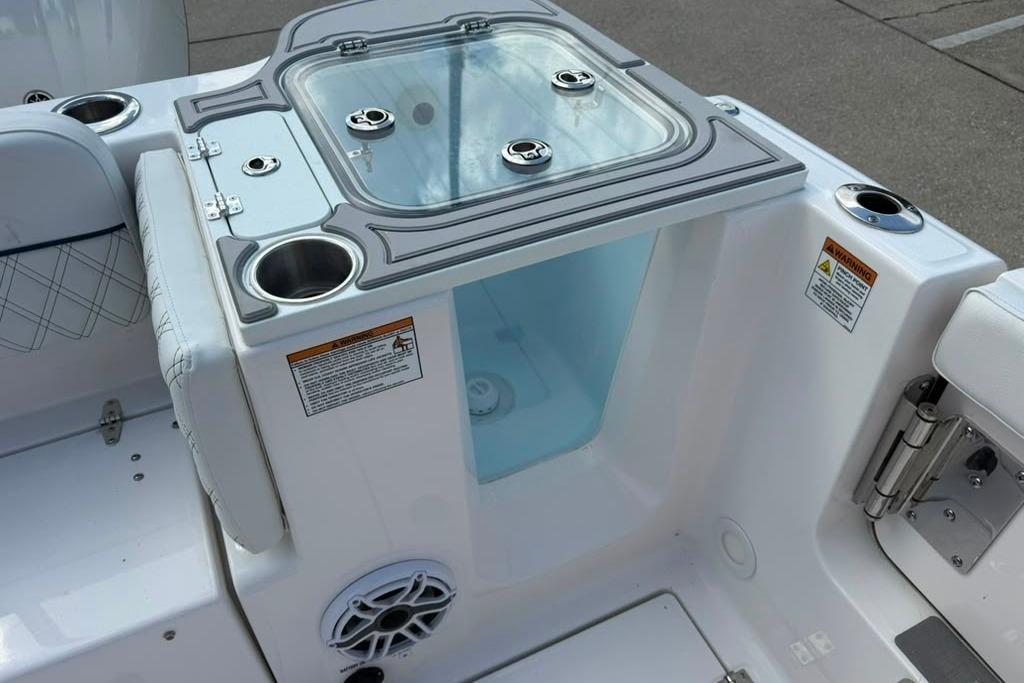 2026 Sea Fox 288 Traveler boat interior with cup holders and storage compartment.