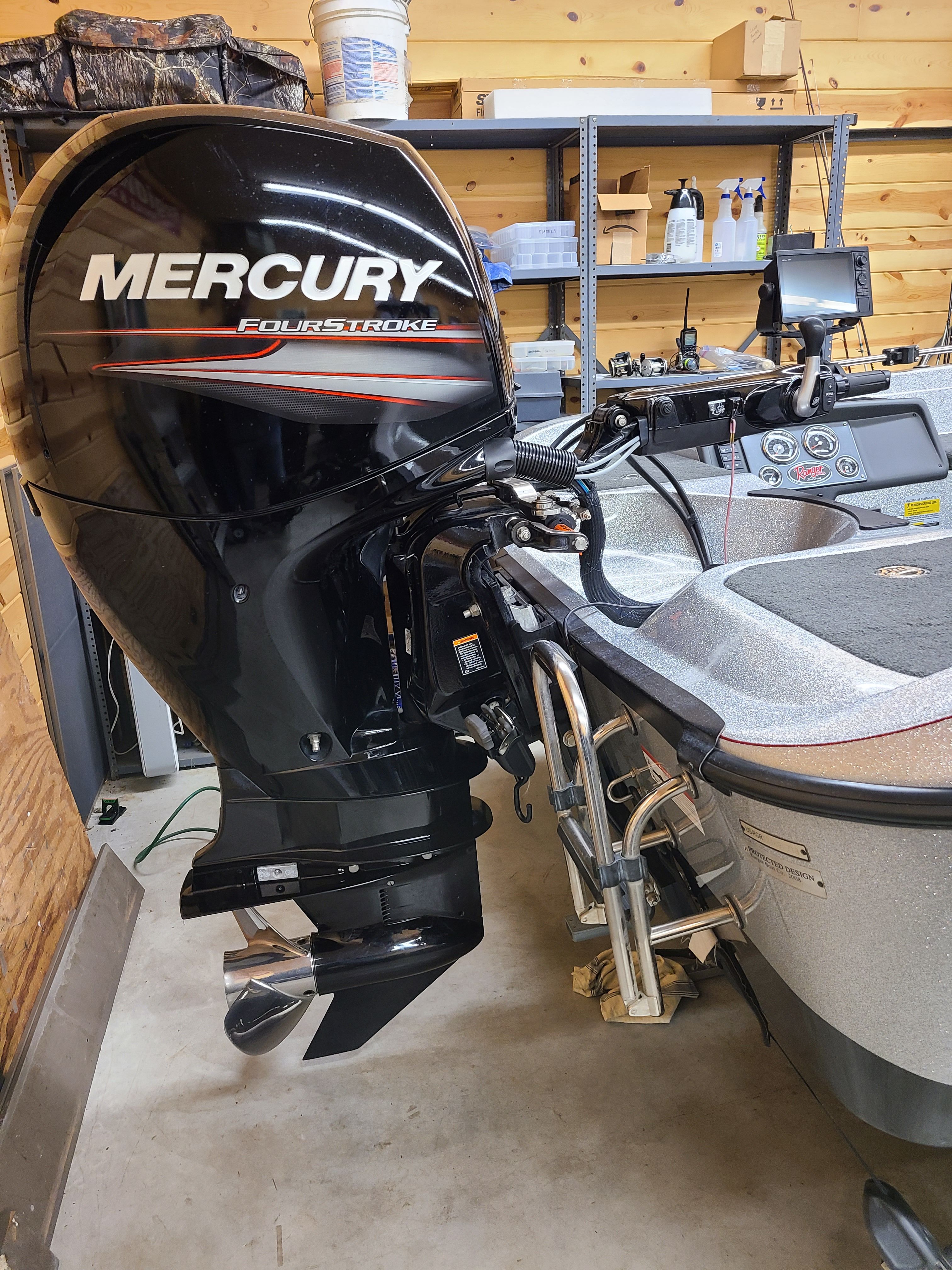 Ranger 620T Fisherman 2018 with Mercury FourStroke engine in garage.