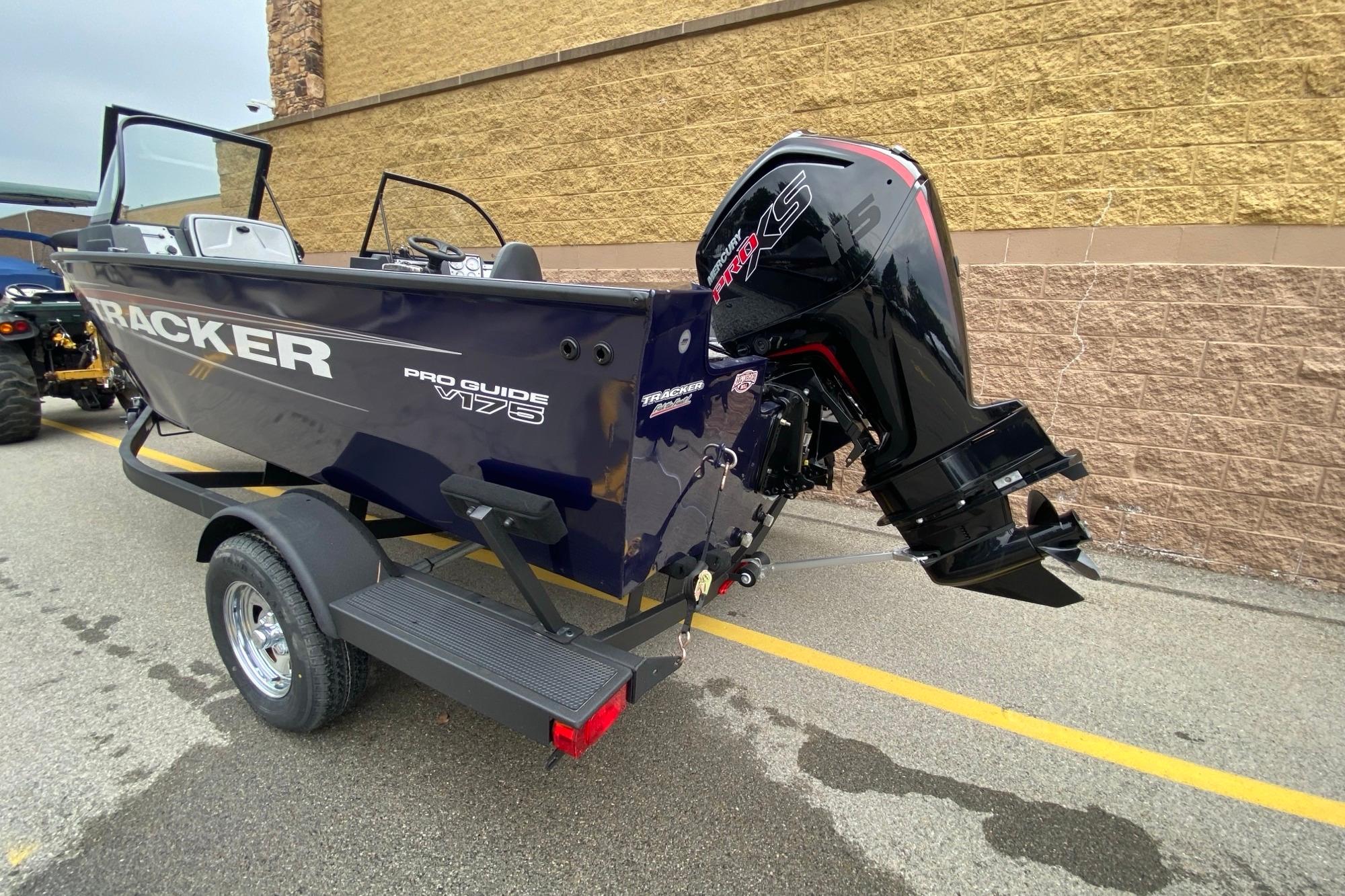 2026 Tracker Pro Guide V-175 WT boat with powerful outboard motor on trailer.