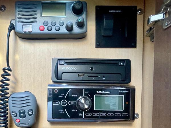 Control panel of a 2014 Sea Ray 330 Sundancer boat with radio and audio system.