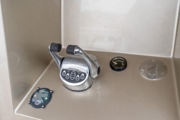 Control panel of 2025 Catamaran Bloomfield 86 Motorsailor with throttle and gauges.