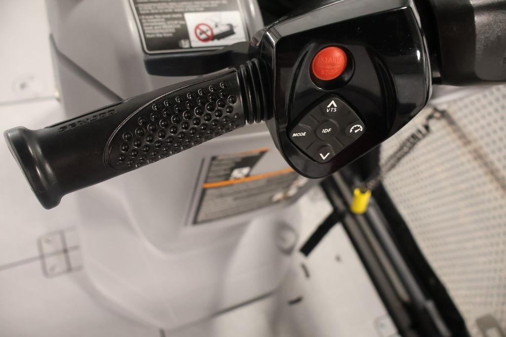Close-up of 2023 Sea-Doo Switch Sport Compact handlebar controls with start button and mode settings.