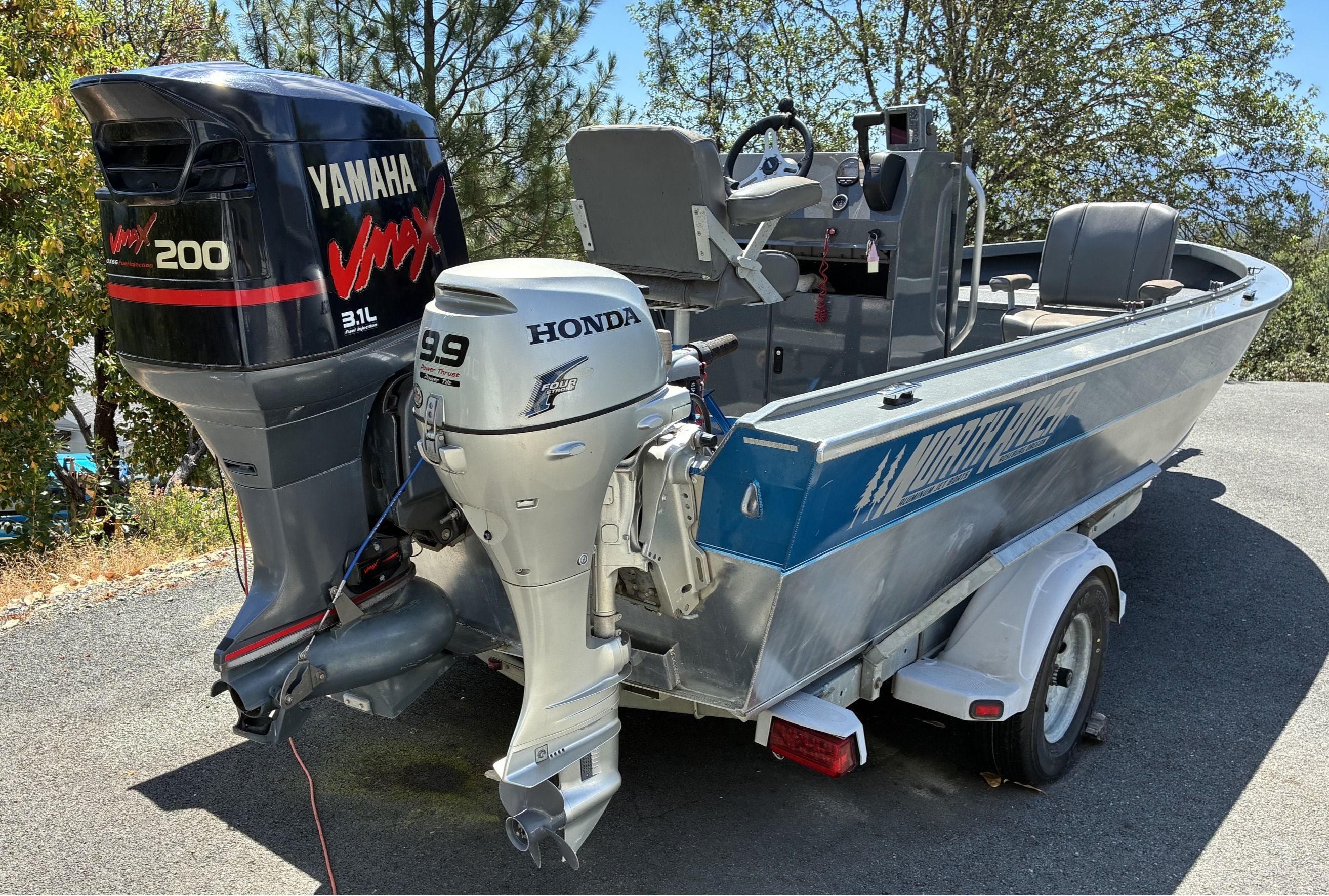 2003 North River SCOUT with Yamaha and Honda engines on a trailer.