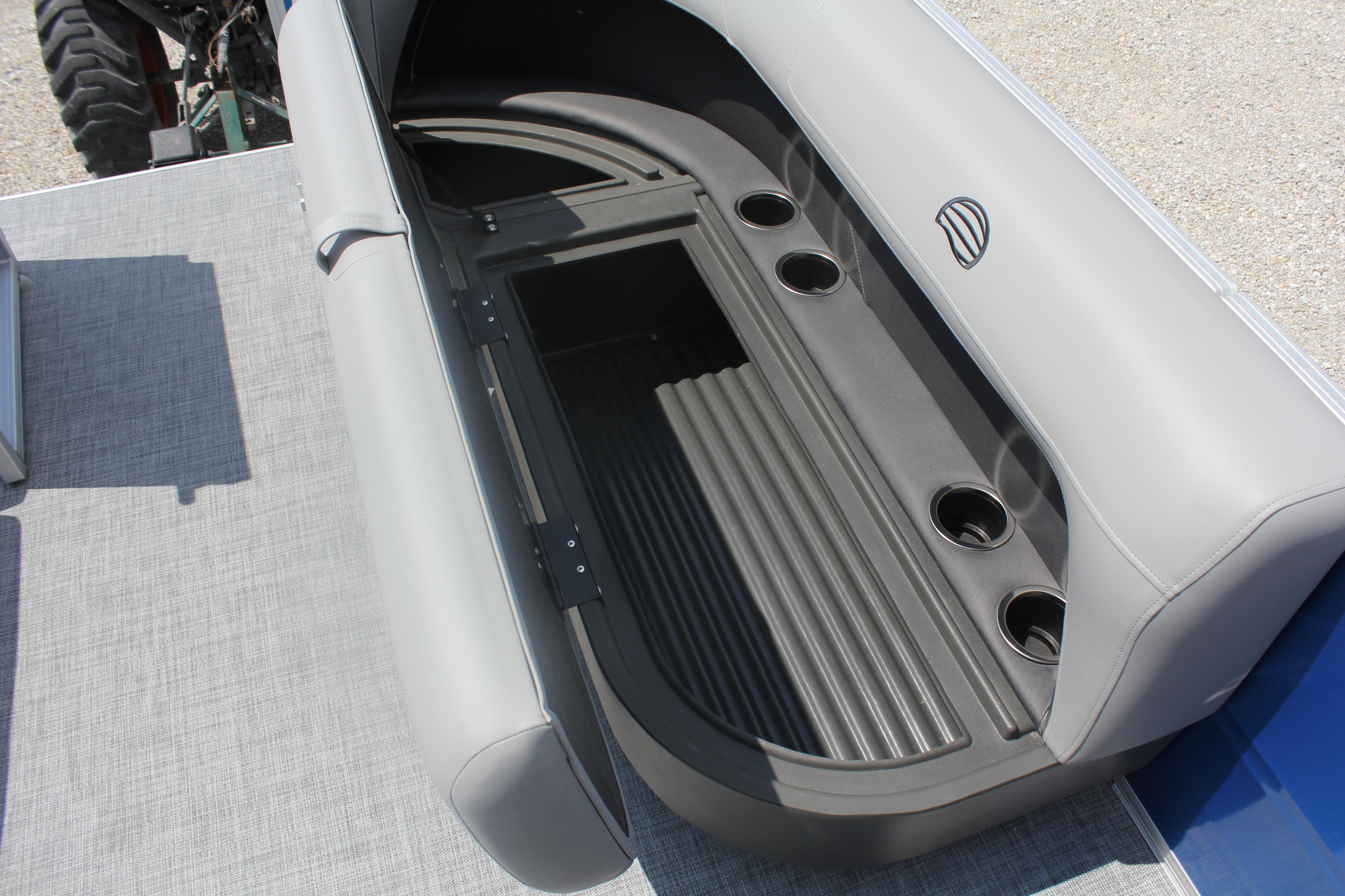 2026 Sun Tracker Party Barge 16 DLX seating with integrated storage and cup holders.