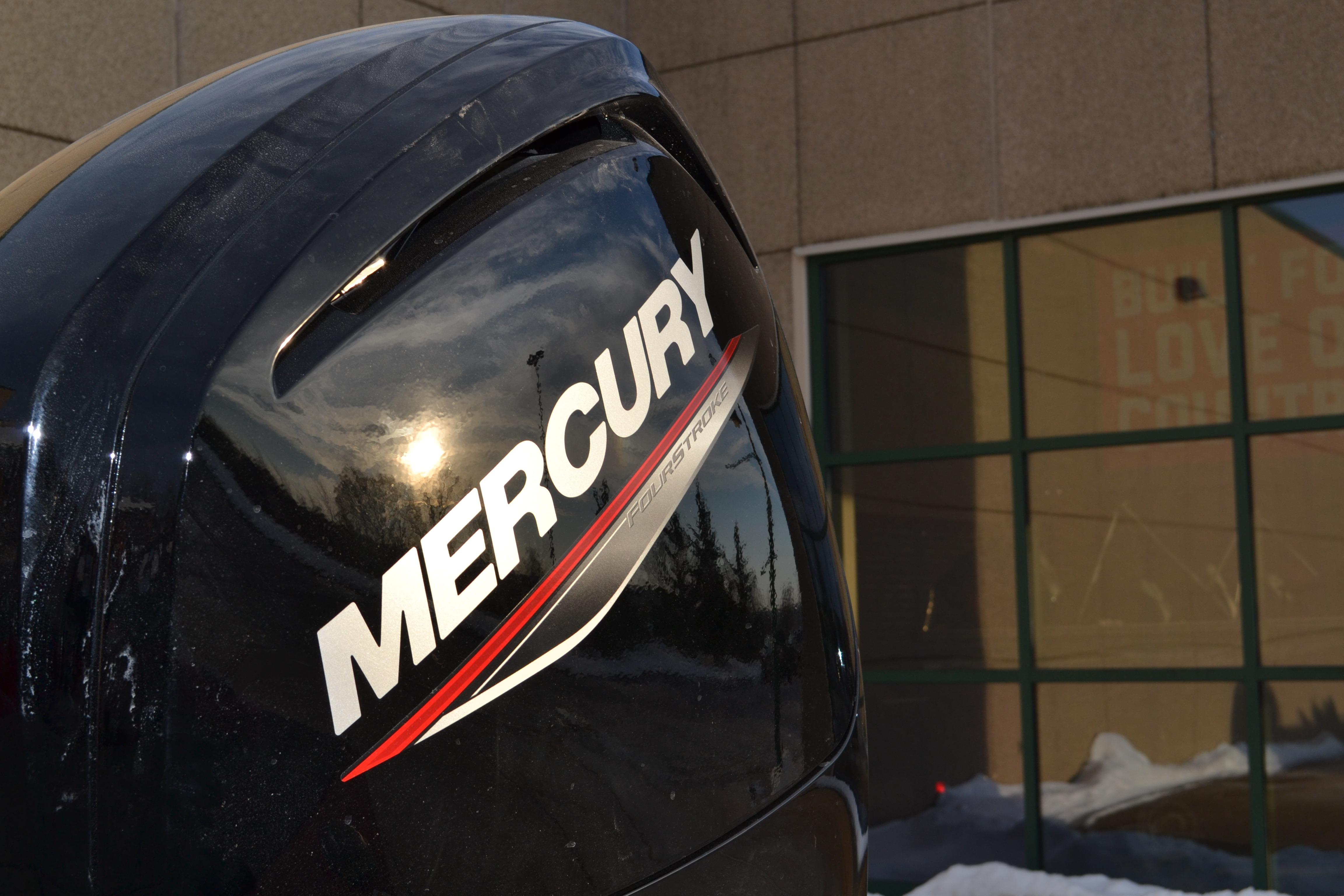 Mercury outboard motor on 2026 Ranger RT188 boat, reflecting sunlight.