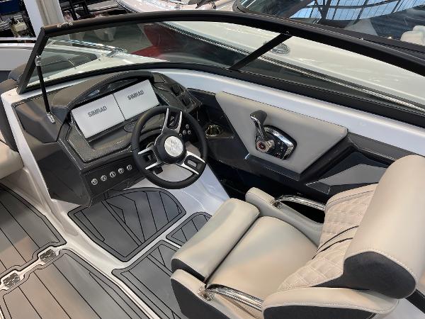 2025 Monterey 218 SS boat interior with modern dashboard and steering wheel.