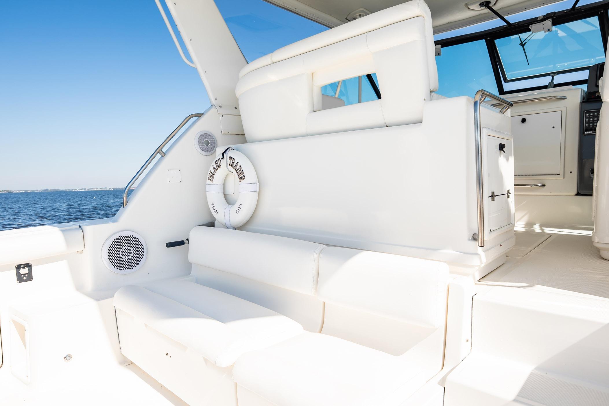 2002 Tiara Yachts 4100 Open interior with white seating and ocean view.