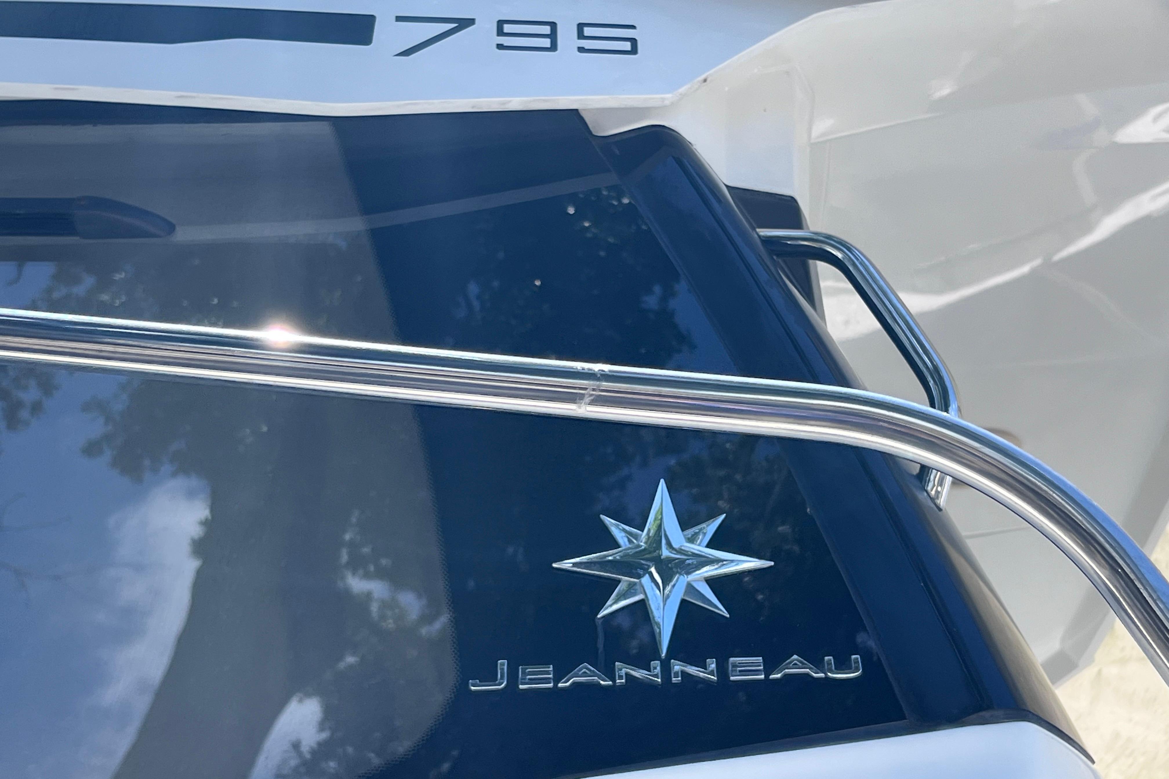 2021 Jeanneau NC Weekender 795 Series 2 boat with logo and railing.