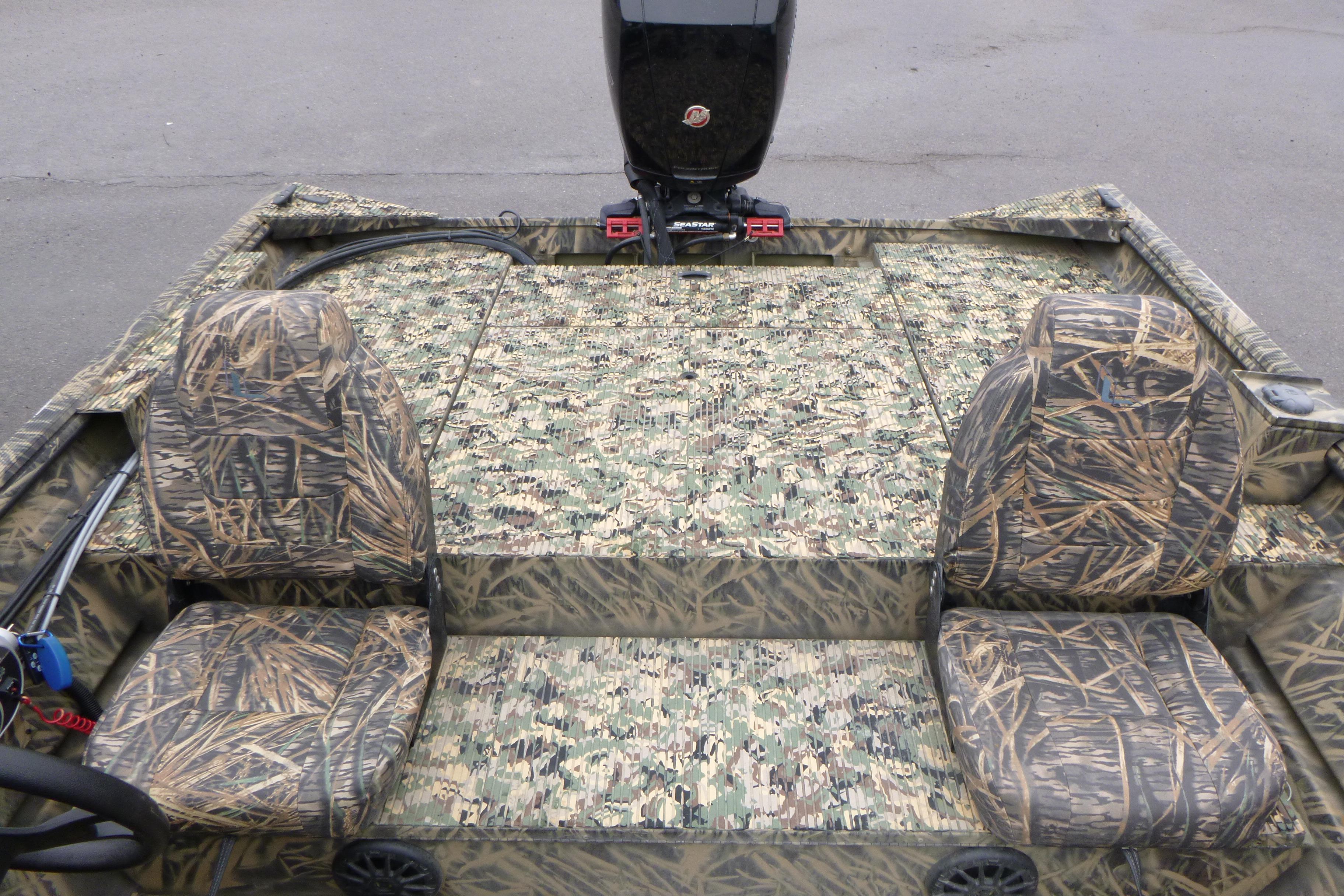 2024 Lowe Roughneck 2070 boat interior with camouflage seating and flooring design.