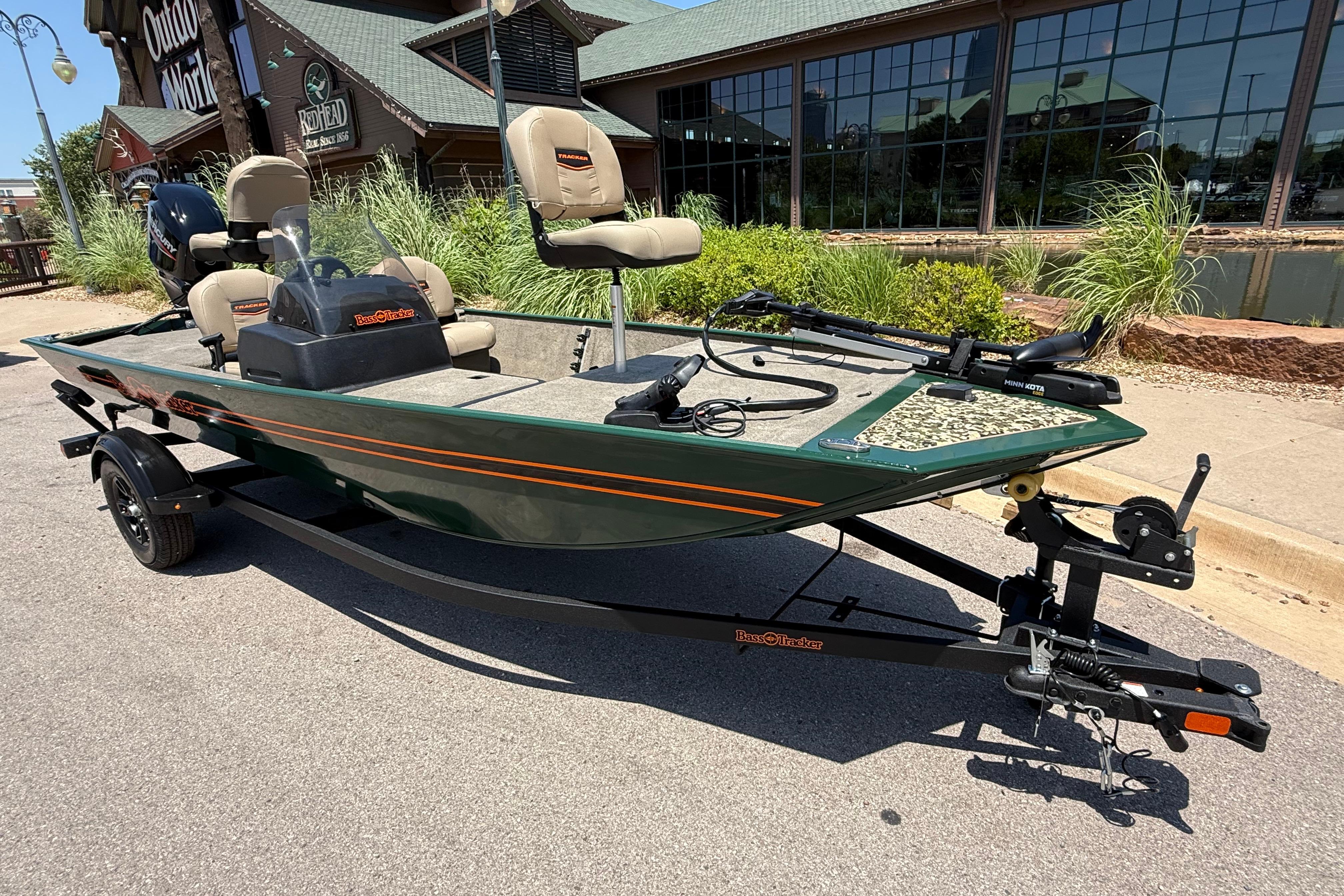 2026 Tracker Bass Tracker Classic Limited fishing boat on trailer, parked outdoors.