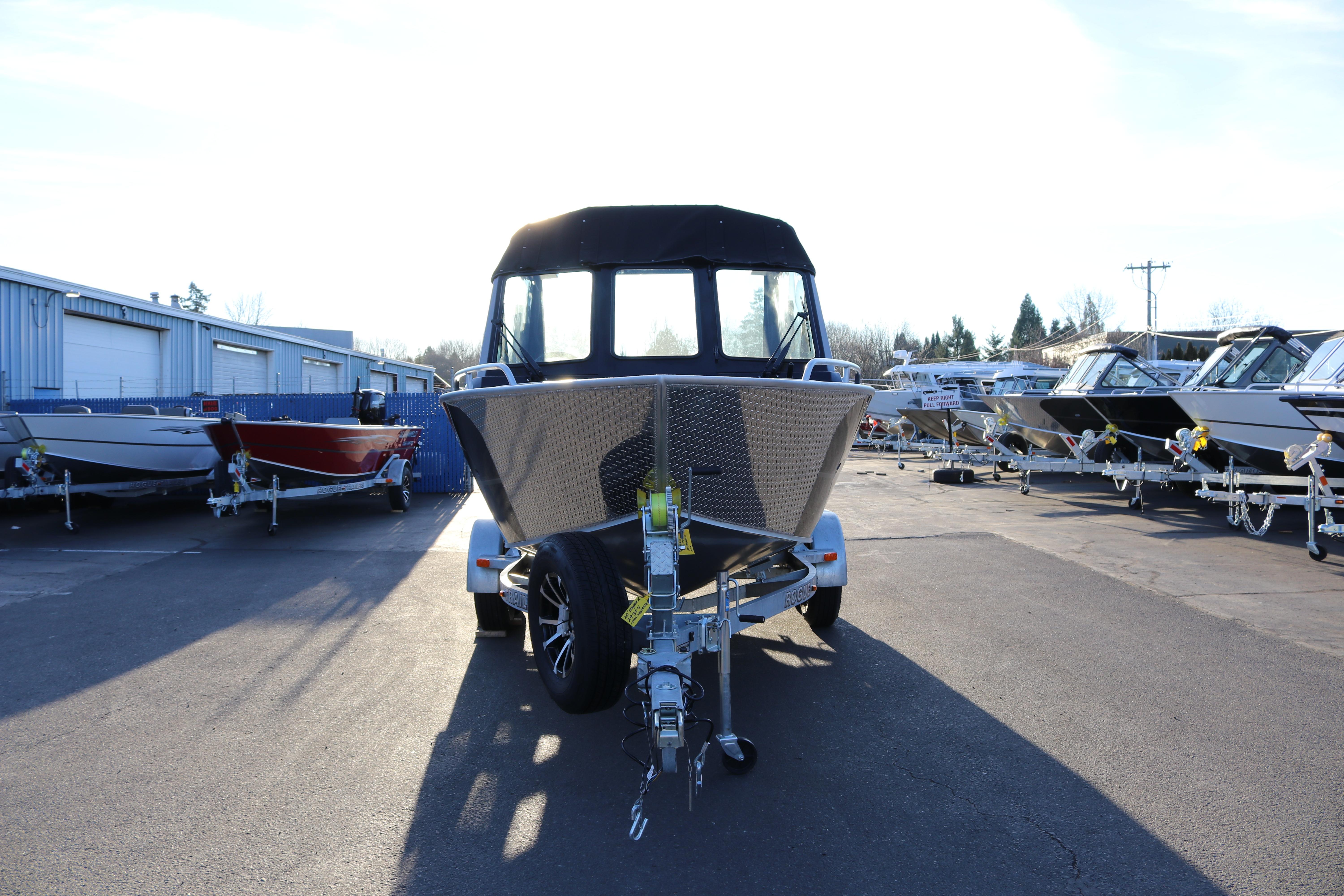 2026 Alumaweld Stryker X202 boat on trailer in a dealership lot.