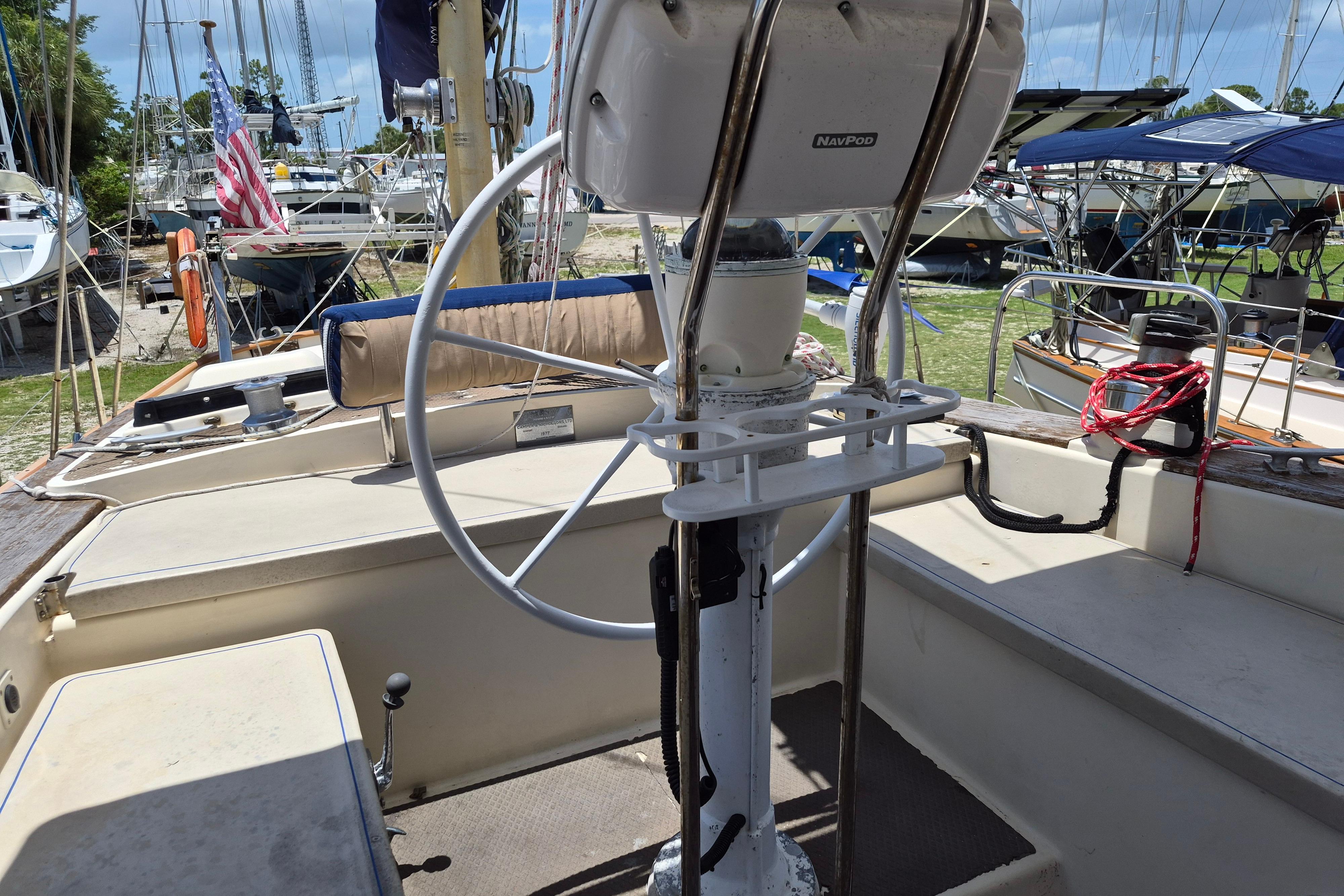 Cockpit of a 1977 Camper & Nicholsons 42 Ketch with steering wheel.