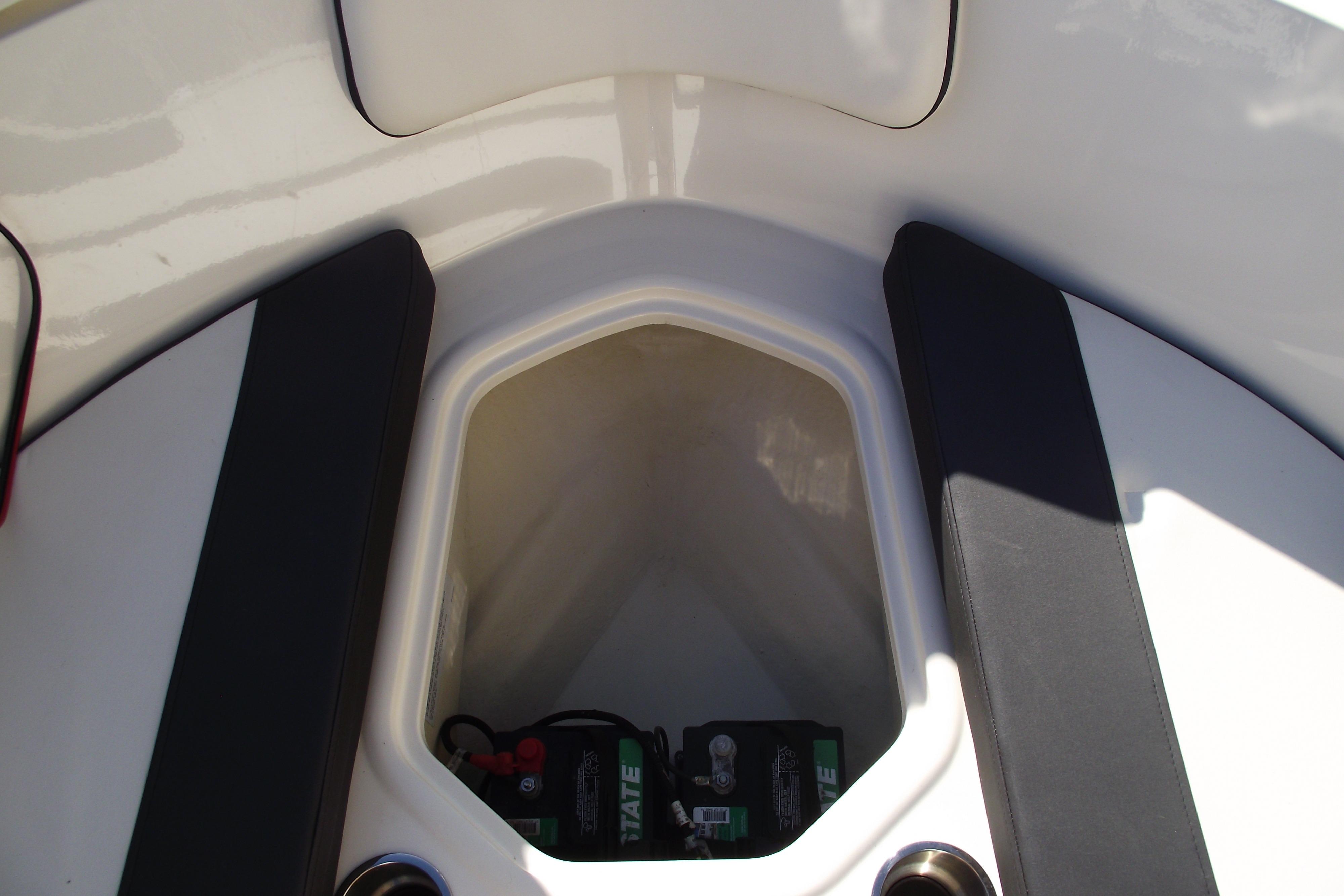 2022 Bayliner VR4 Bowrider OB storage compartment with battery visible.