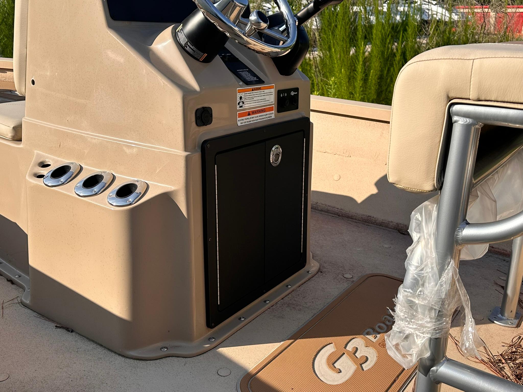 2024 G3 Bay 20 GX boat interior with steering console and seating area.