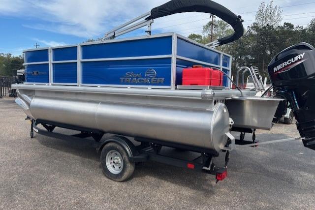 2026 Sun Tracker Party Barge 16 DLX pontoon boat with Mercury outboard motor on trailer.